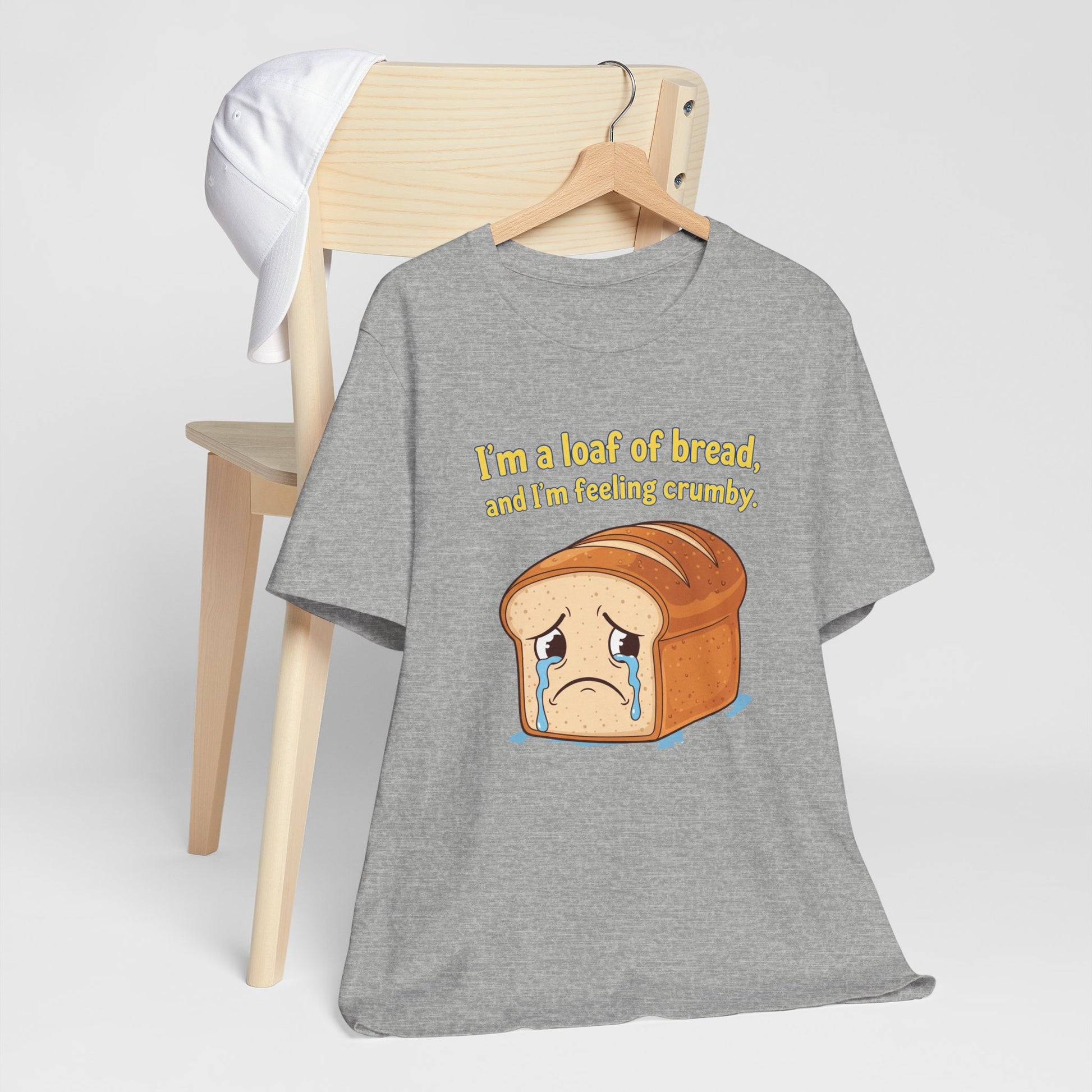 Gray t-shirt with bread graphic and text on a white background. Text says 'I'm a loaf of bread, and I'm feeling crumby'