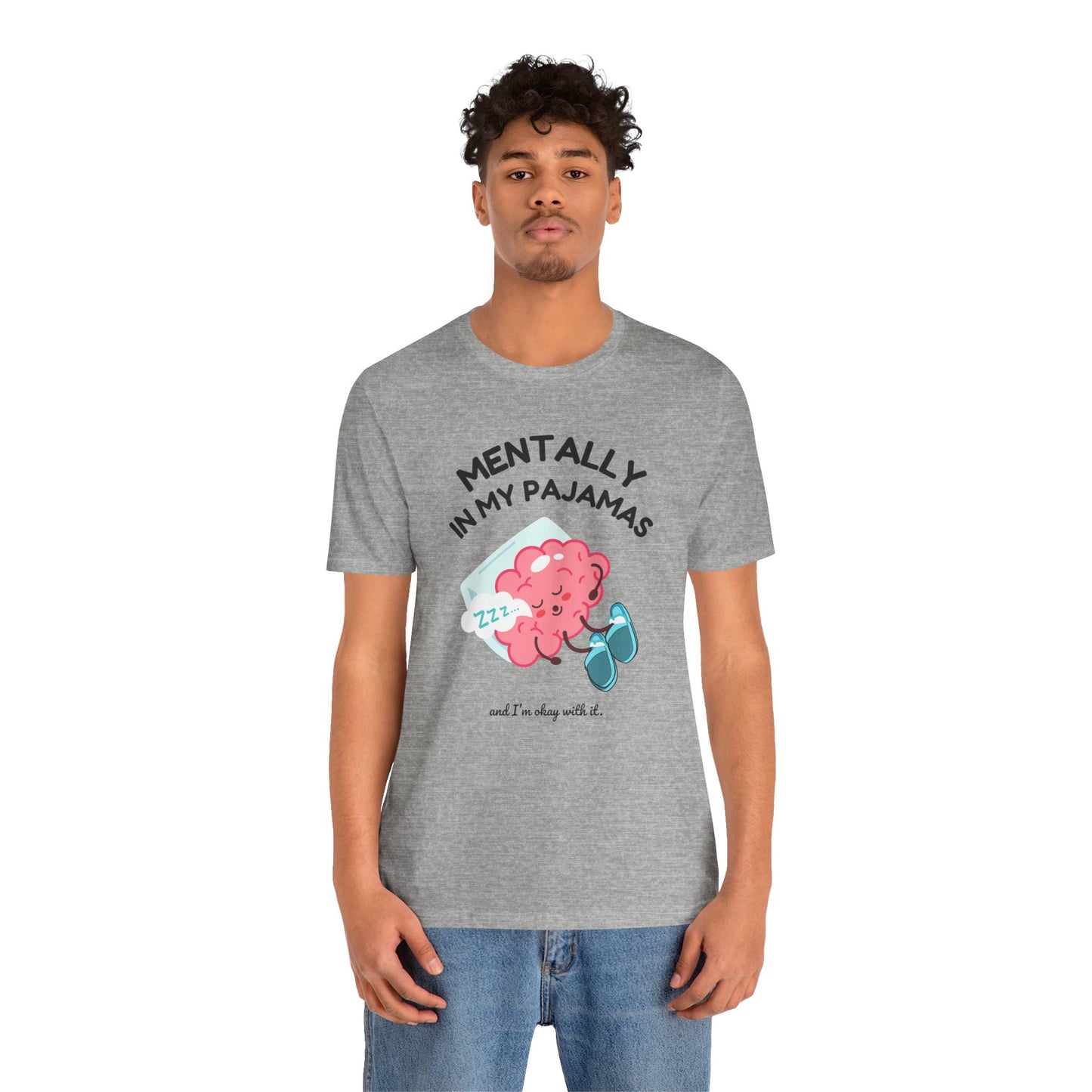 Person wearing a gray t-shirt with a graphic design and text 'Mentally in my pajamas and I'm ok with it' on a white background