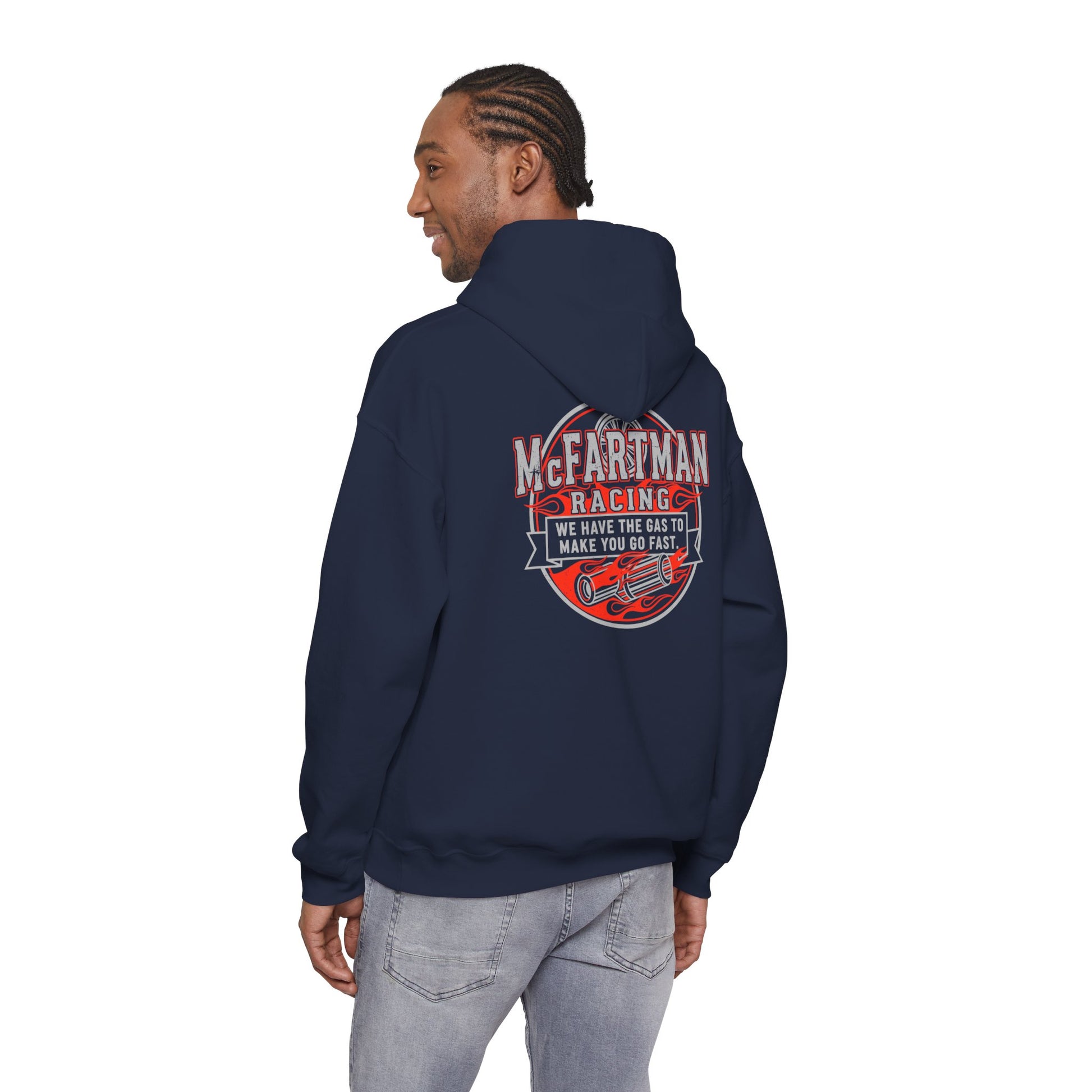 Person wearing a navy hoodie with a racing graphic McFartman Racing We have the gas to make you go fast on the back, standing against a white background