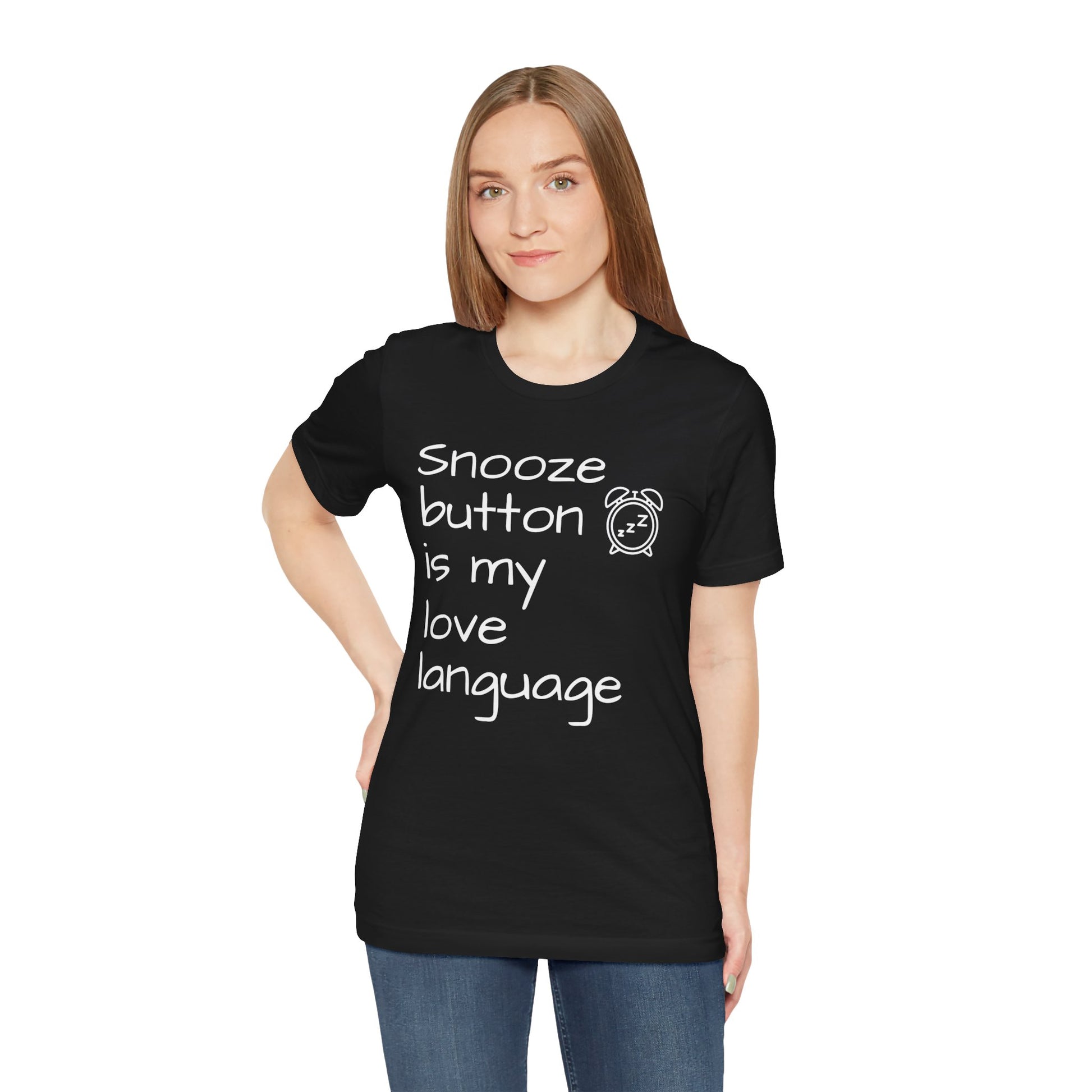 Person wearing a black t-shirt with text 'Snooze button is my love language' on a white background
