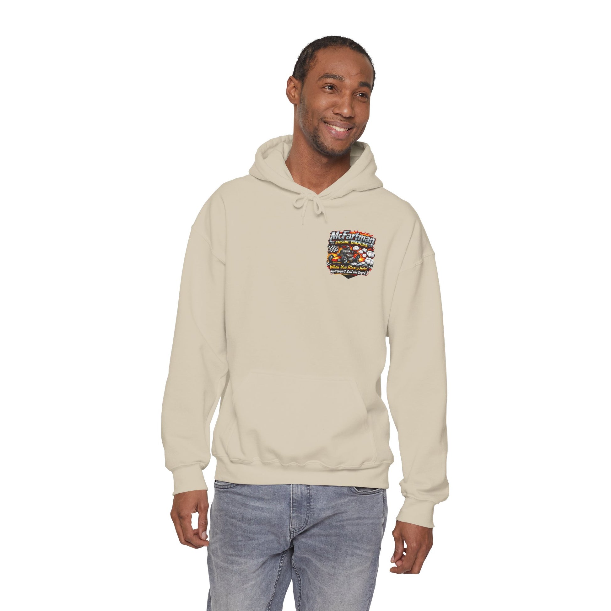 Man wearing a beige Gildan 18500 hoodie with a colorful 'McFartman Engine Diapers' logo graphic on the chest against a white background