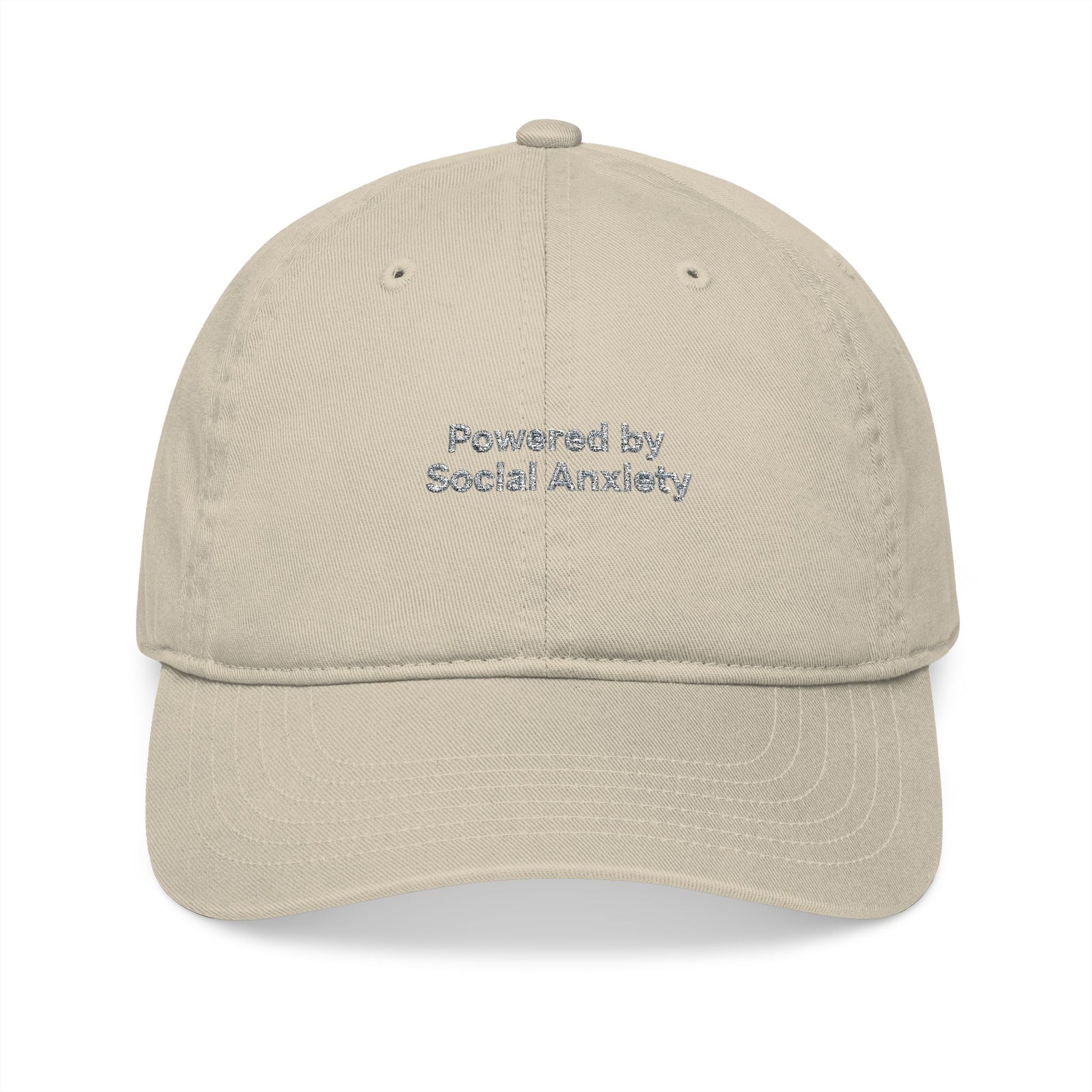 Beige cap with 'Powered by Social Anxiety' text on a white background