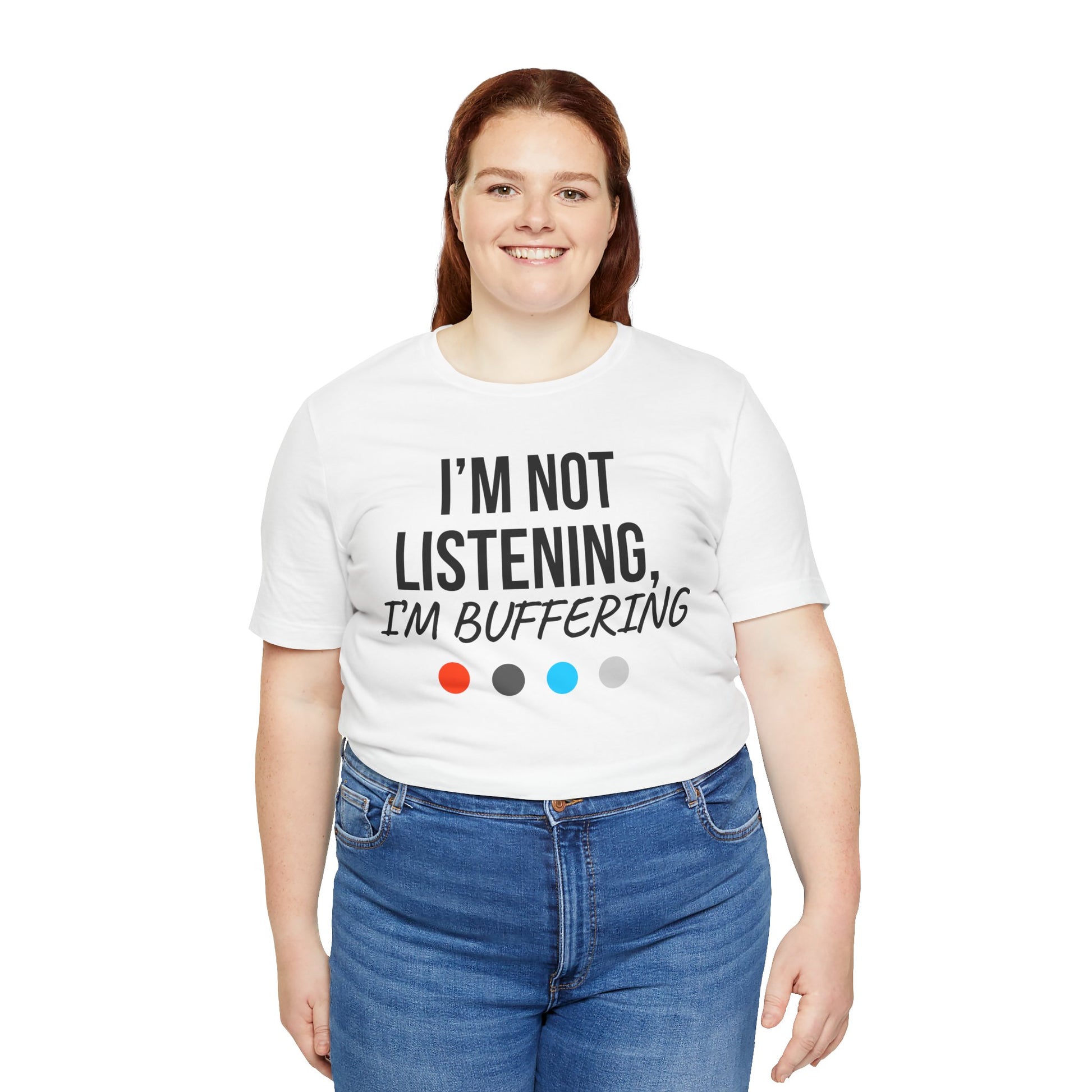 Person wearing a white t-shirt with 'I'm not listening, I'm buffering' text and colorful dots on a white background