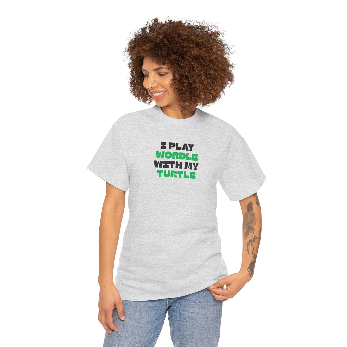 Woman wearing a gray t-shirt with text 'I play wordle with my turtle' on a white background