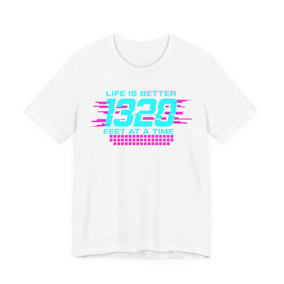 White t-shirt with colorful text 'Life is better 1320 feet at a time' design on a white background