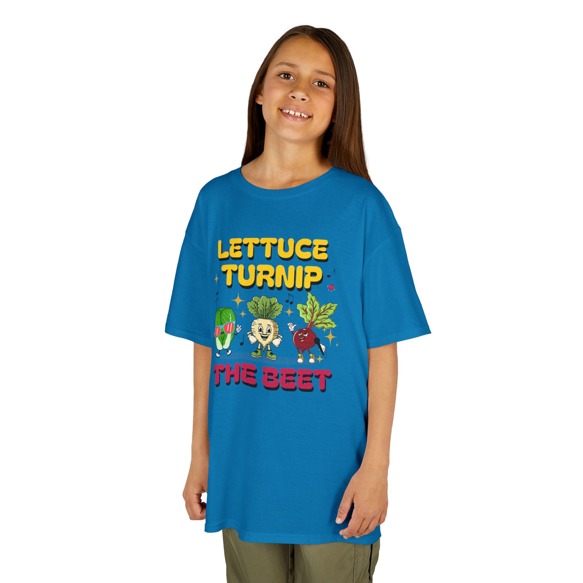 Child wearing a blue t-shirt with colorful vegetable graphics and text 'Lettuce Turnip the Beet' on a white background