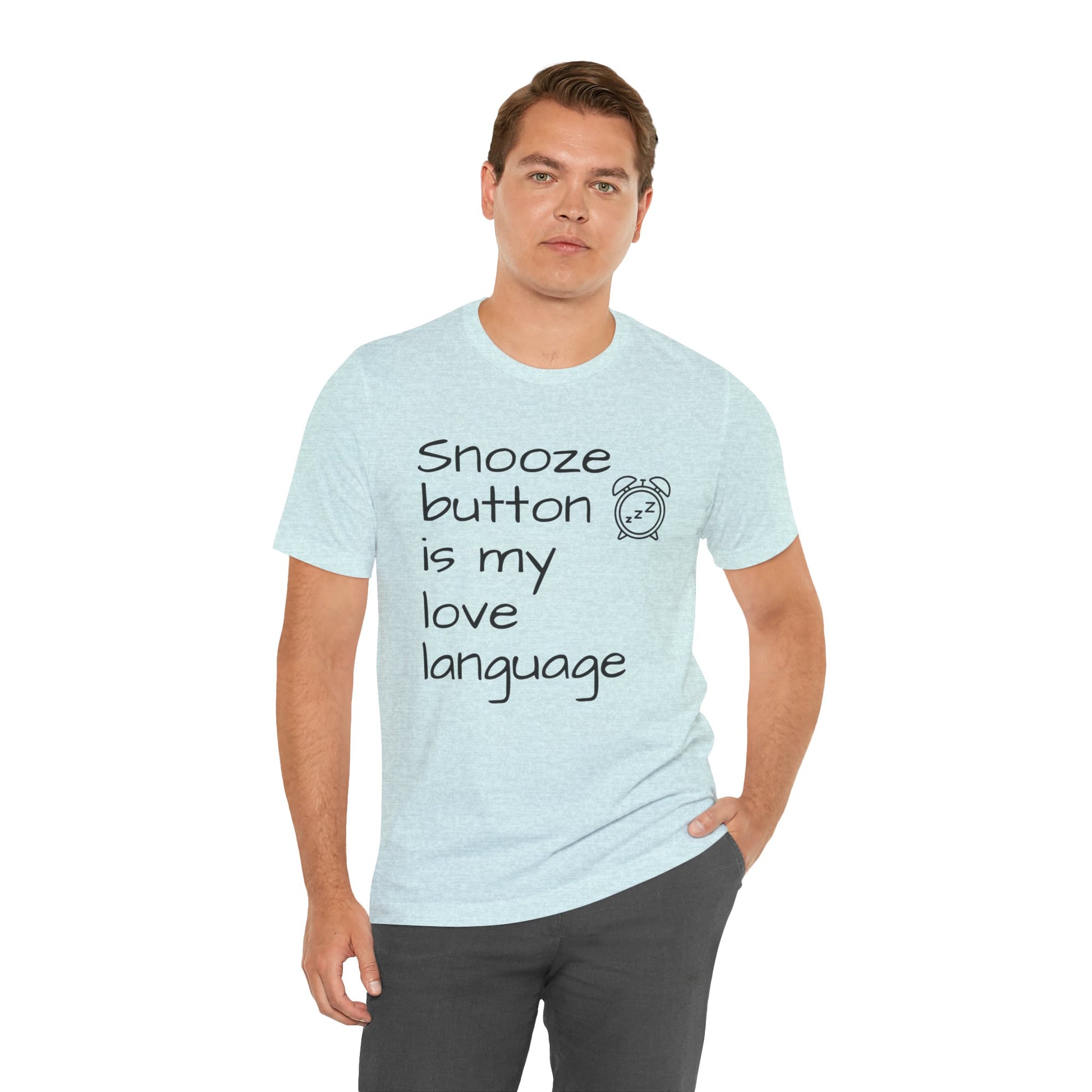 Man wearing a light blue t-shirt with text  'Snooze button is my love language' and a graphic on a white background