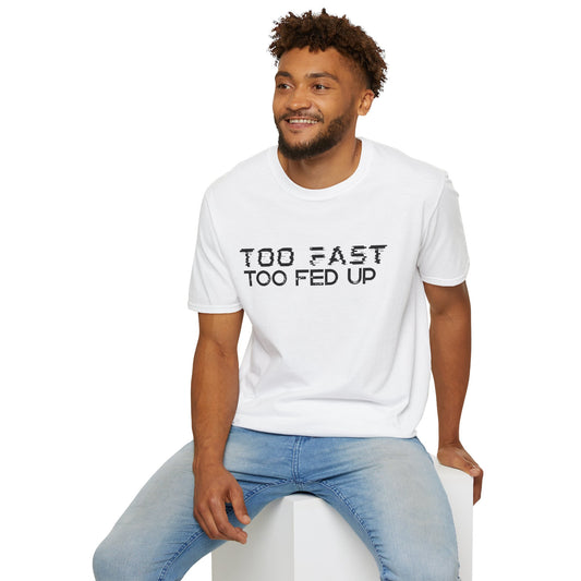 Man wearing a white t-shirt with text 'Too Fast Too Fed Up' sitting on a white stool against a white background