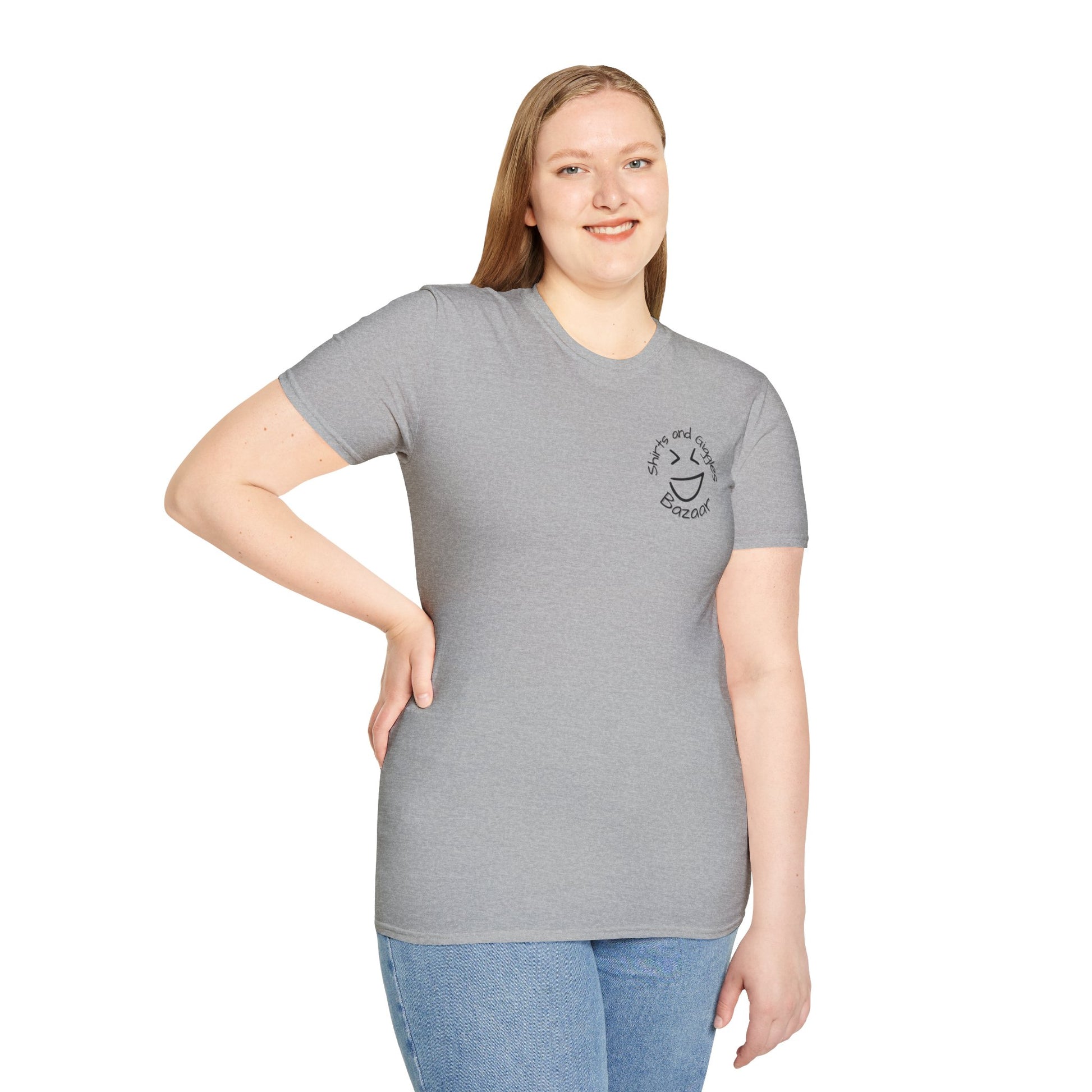 Woman wearing a gray t-shirt with a smiley face 'Shirts and Giggles Bazaar' logo design on a white background