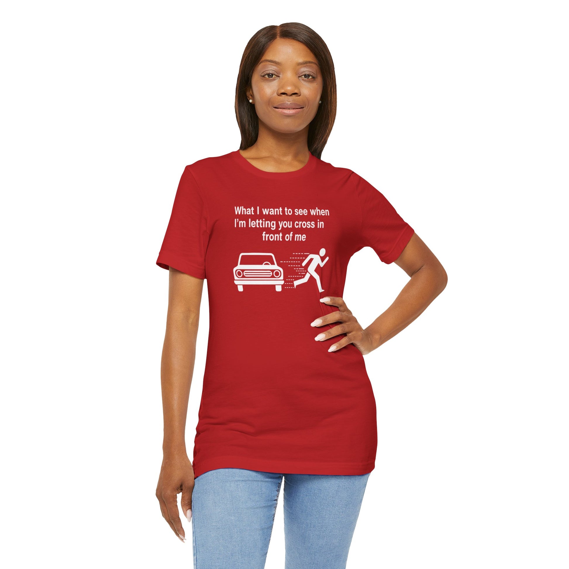 Woman wearing a red t-shirt with a humorous graphic and text 'What I want to see when I'm letting you cross in front of me' on a white background