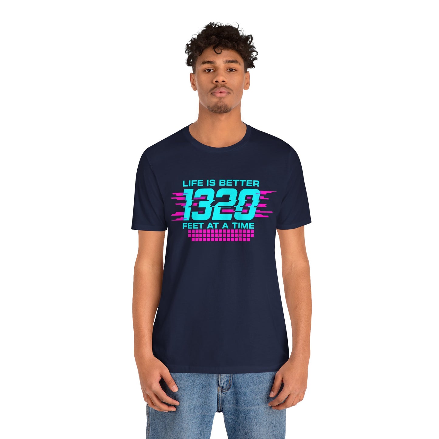 Person wearing a navy blue t-shirt with colorful text 'Life is better 1320 feet at a time' design on a white background