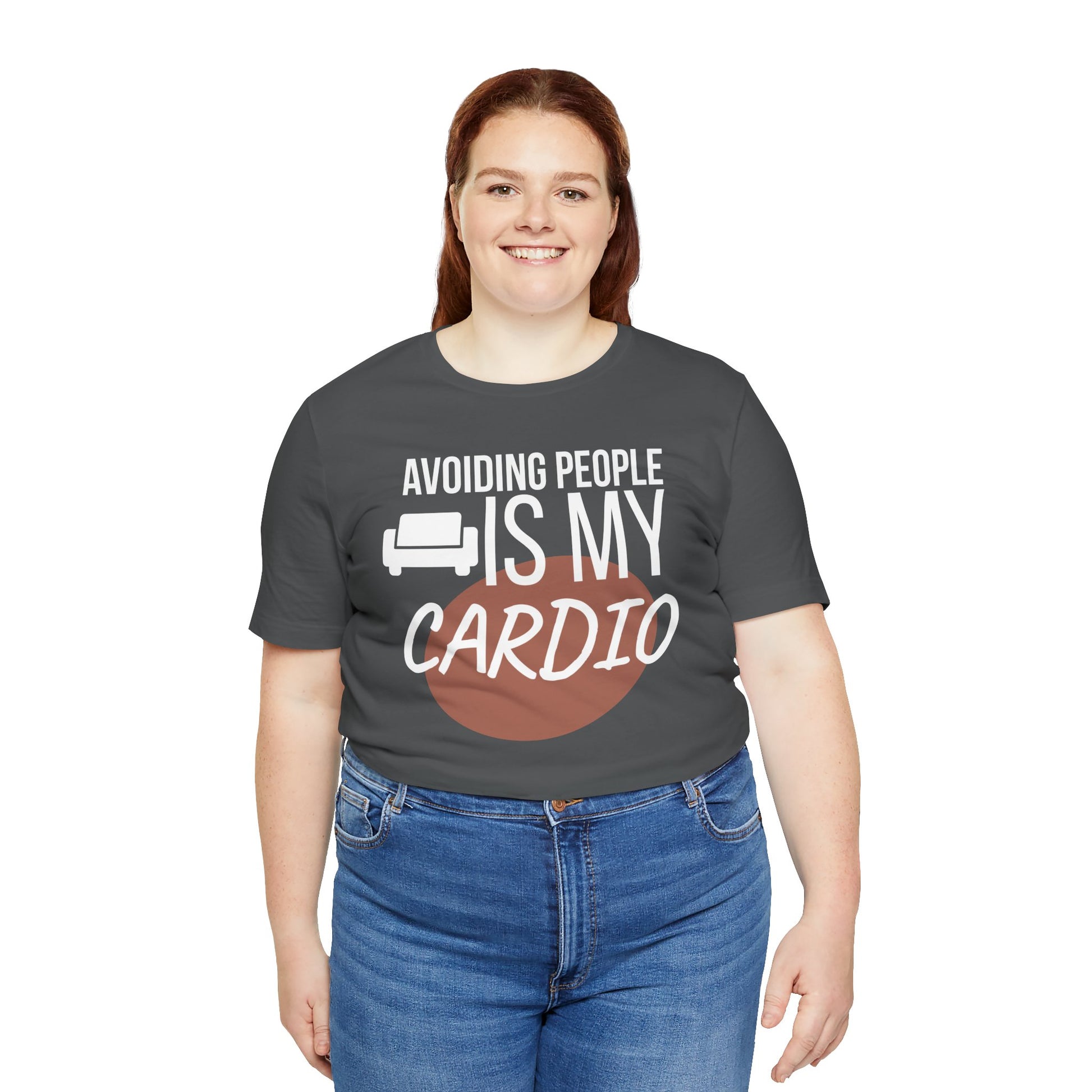 Person wearing a dark gray t-shirt with humorous text 'Avoiding People Is My Cardio' design on a white background