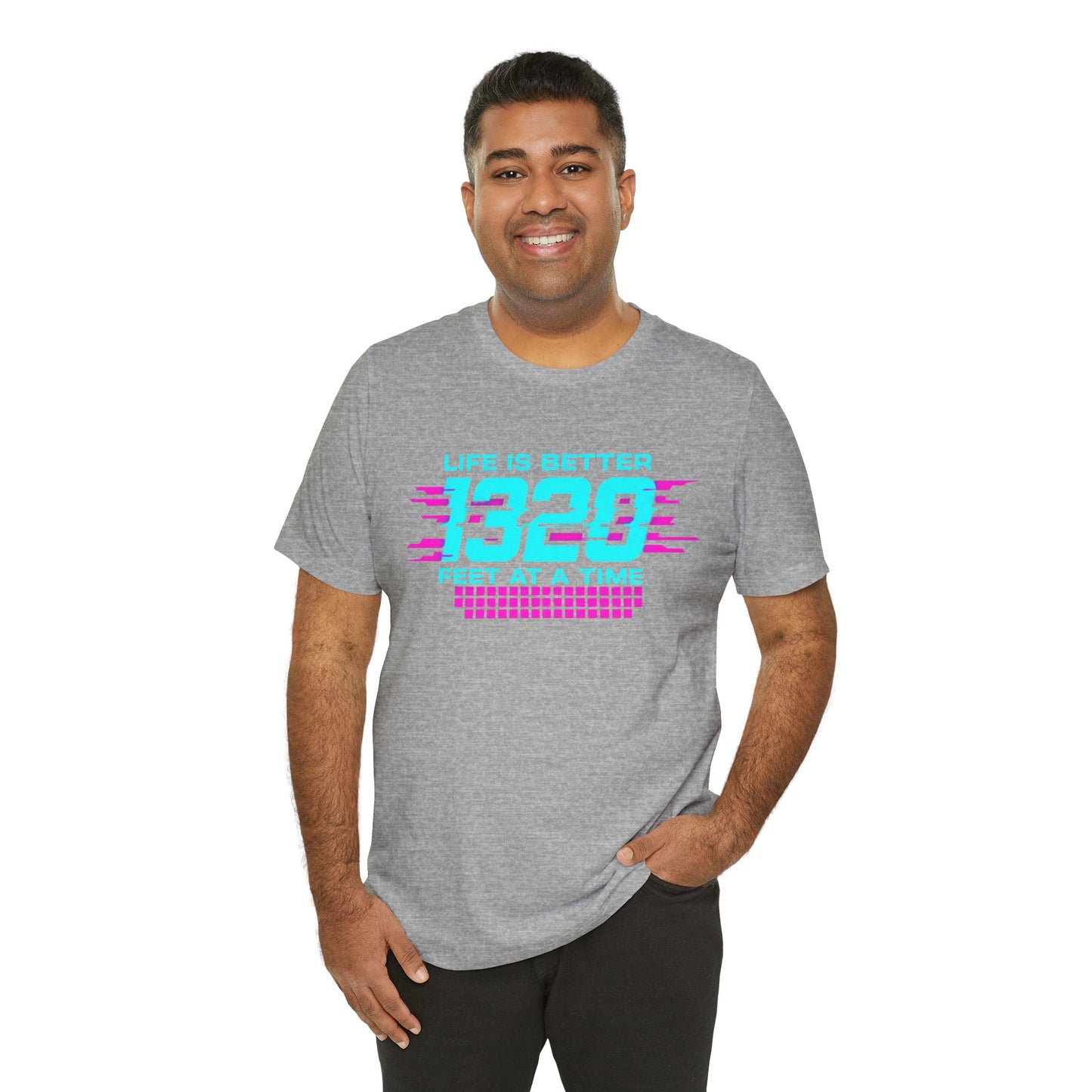Man wearing a gray t-shirt with colorful text 'Life is better 1320 feet at a time' design on a white background