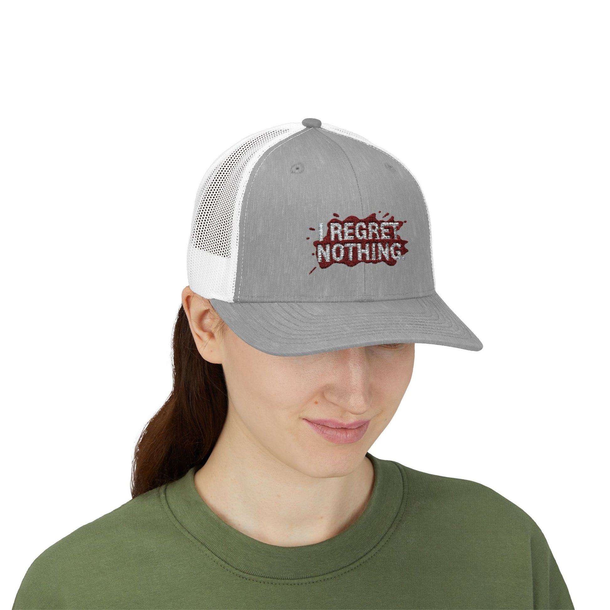 Person wearing a gray and white cap with 'I Regret Nothing' text on a white background