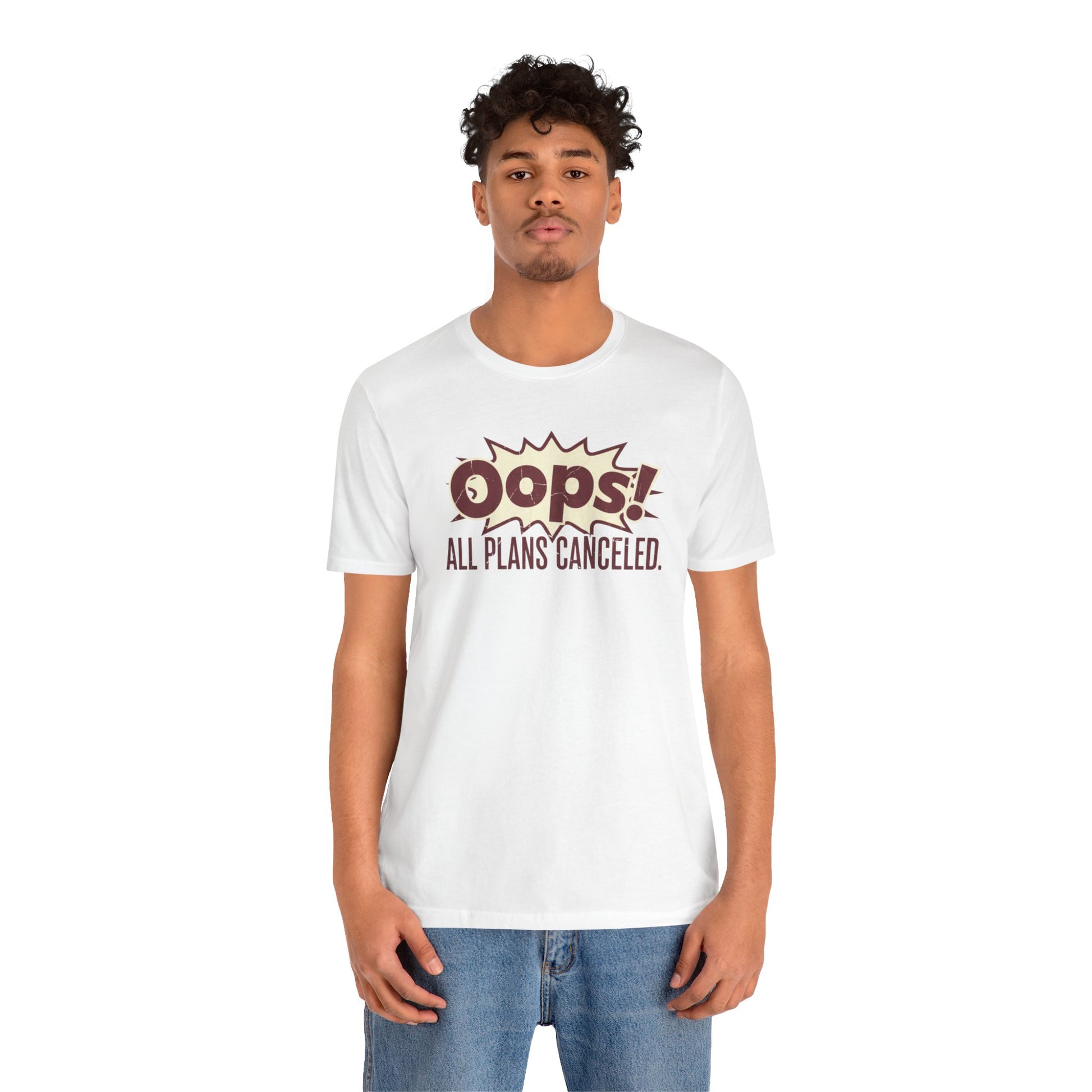 Person wearing a white t-shirt with 'Oops! All plans canceled.' text on a white background