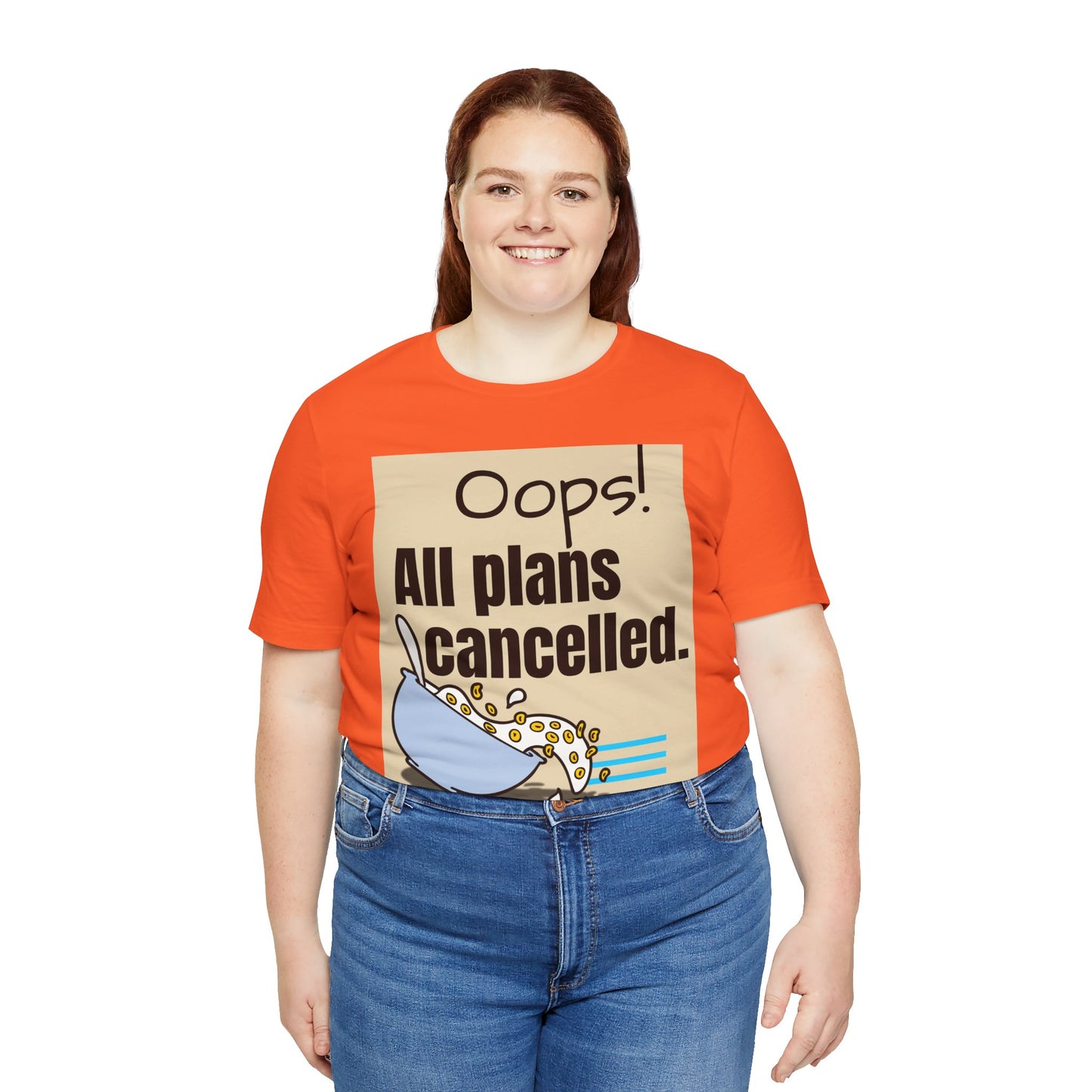 Person wearing an orange t-shirt with a graphic and text 'Oops! All plans cancelled.'