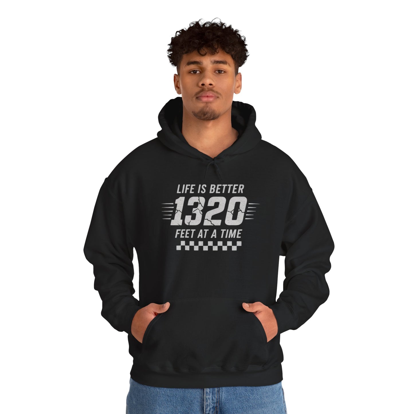 Person wearing a black hoodie with text 'Life is better 1320 feet at a time' on a white background