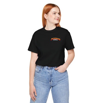 Person wearing a black t-shirt with a 'Jackedman Timmy' logo and blue jeans on a white background