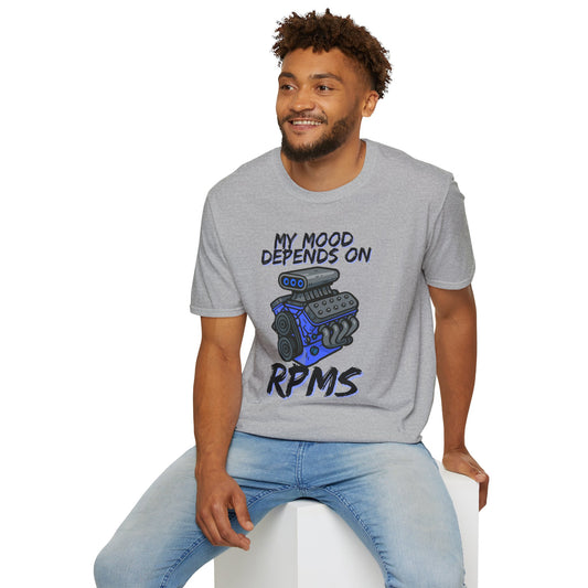 Man wearing a gray t-shirt with a graphic and text, sitting on a white stool against a white background.