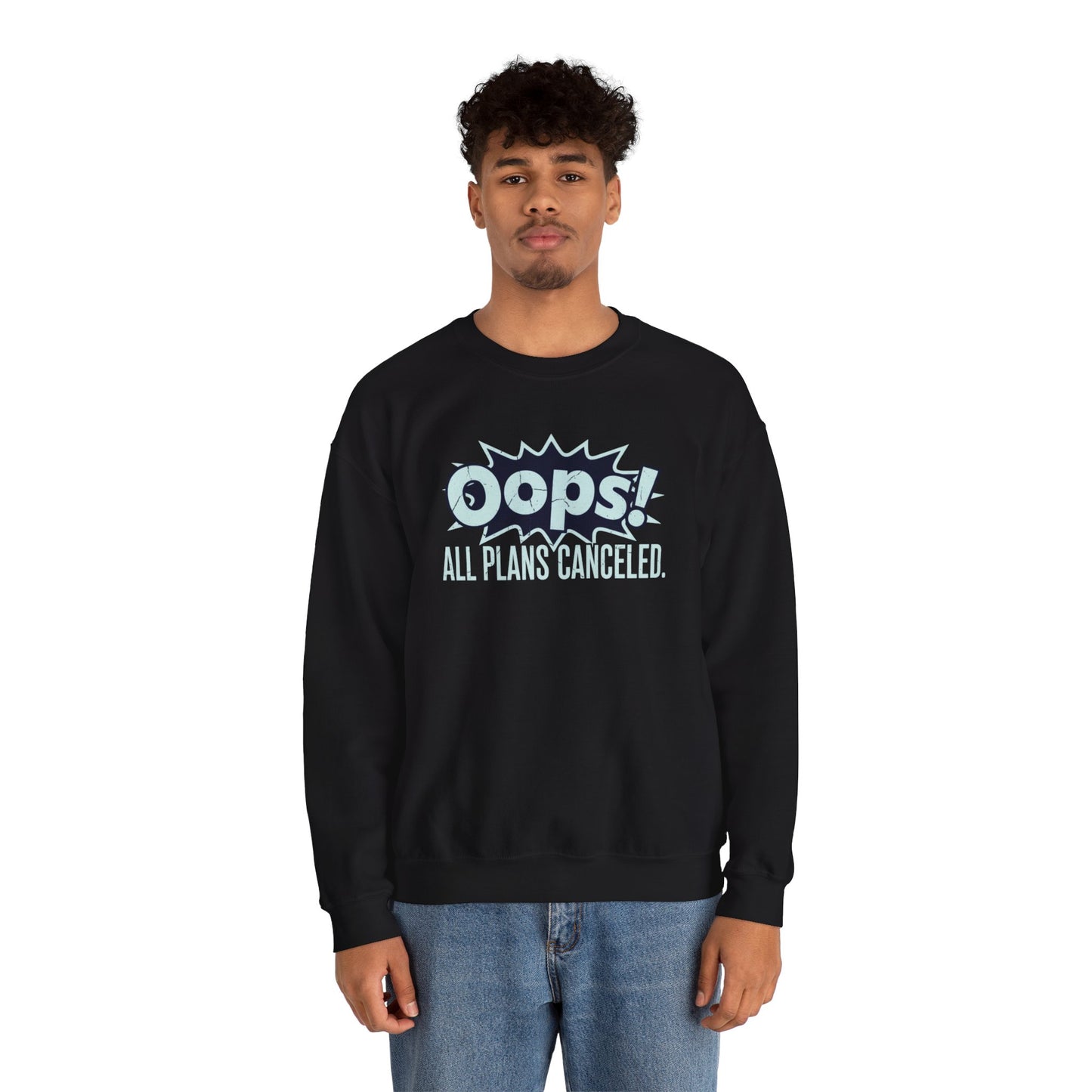 Person wearing a black sweatshirt with 'Oops! All Plans Cancelled' text on a white background