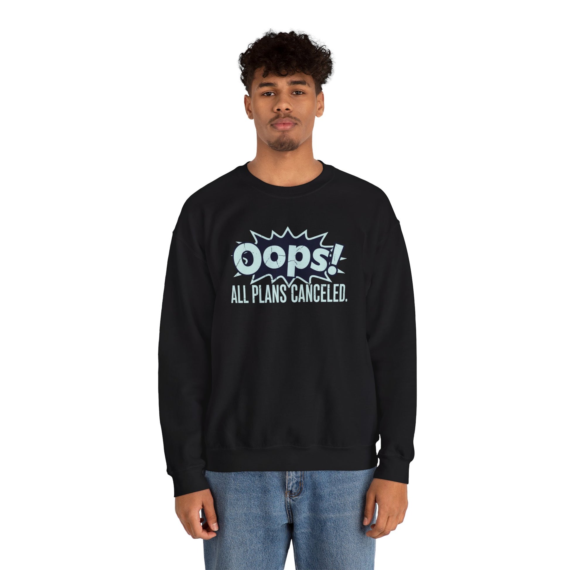 Person wearing a black sweatshirt with 'Oops! All Plans Cancelled' text on a white background