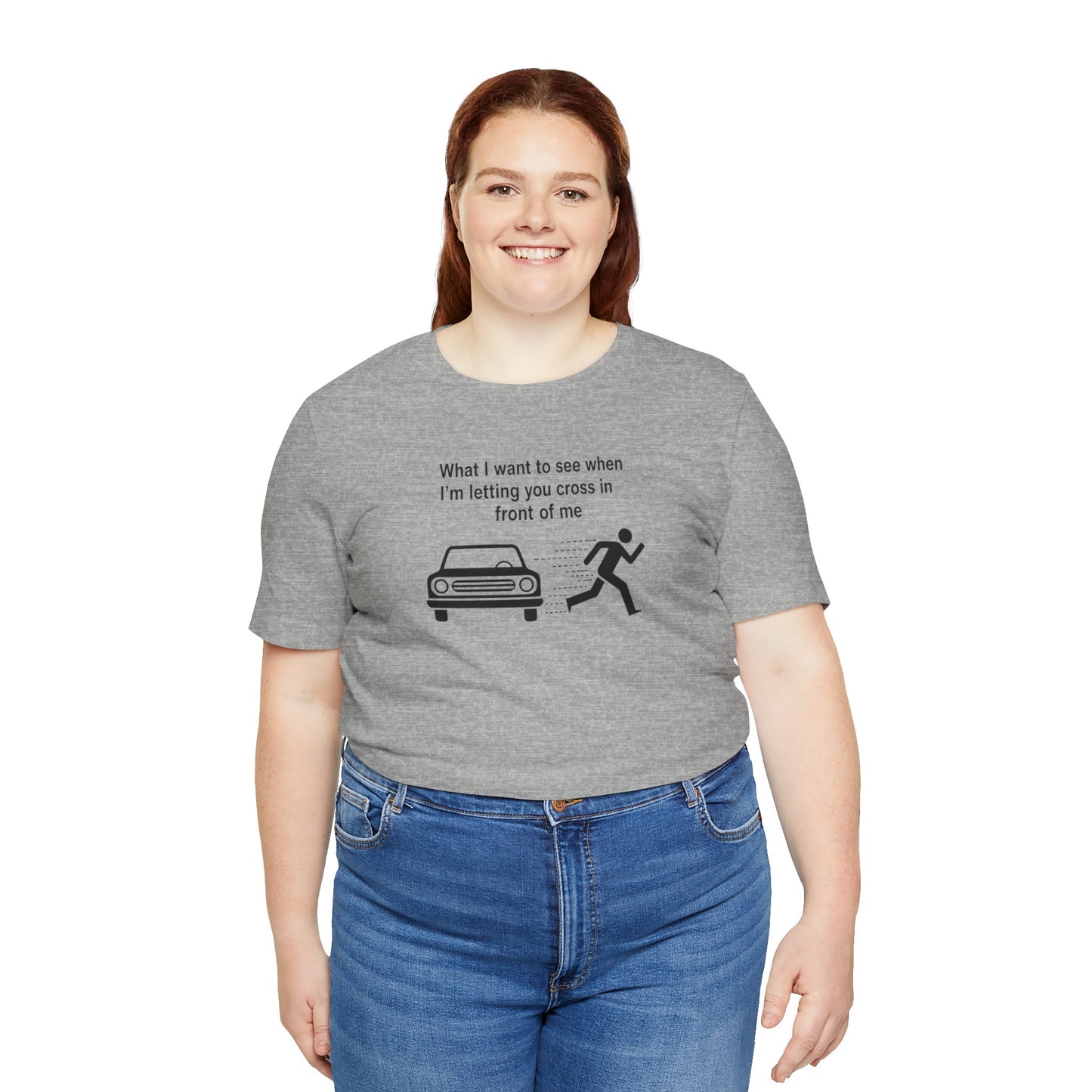 Person wearing a gray t-shirt with a graphic and text 'What I want to see when I'm letting you cross in front of me'on a white background