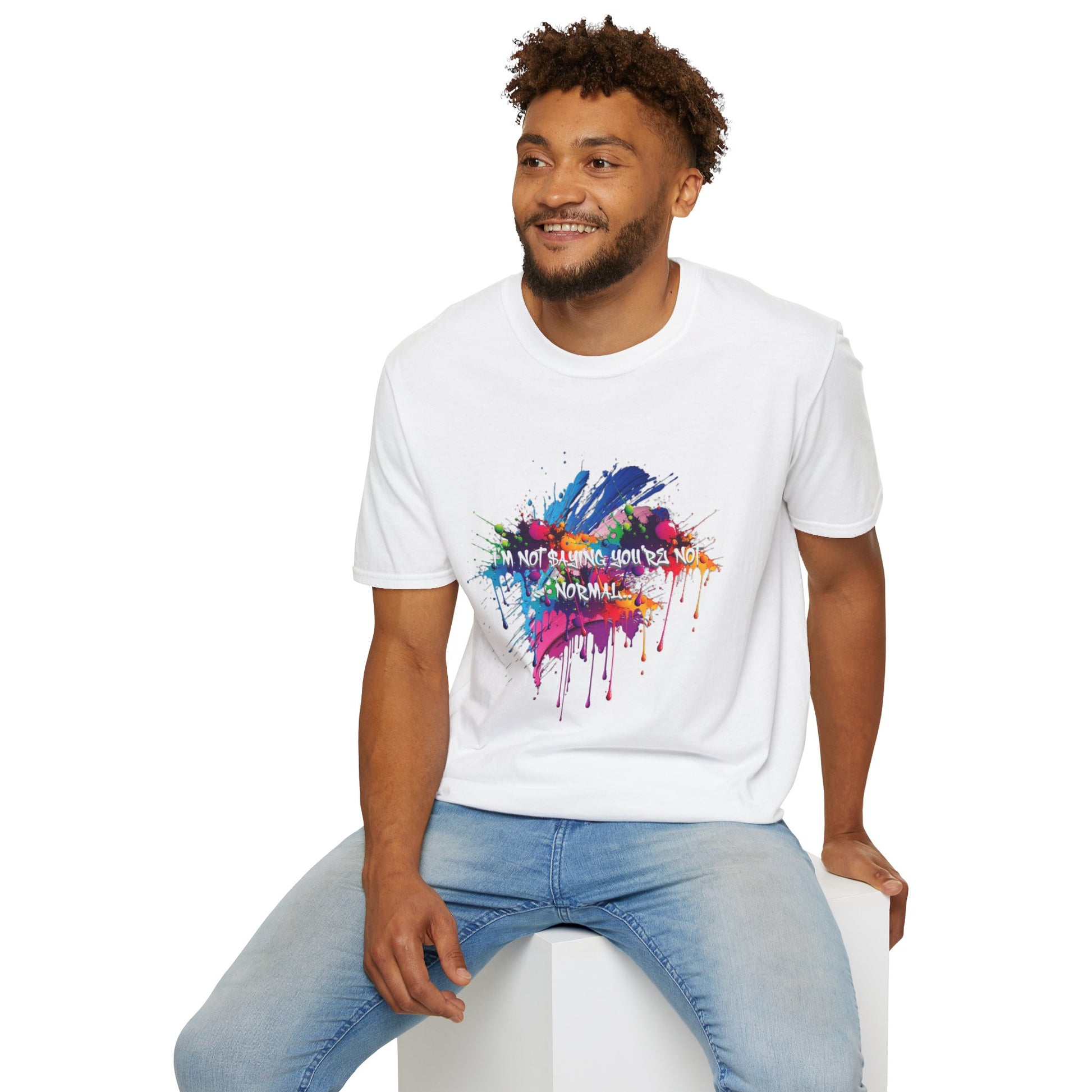 Man wearing a white t-shirt with colorful graphic design and text 'I'm not saying you're not normal.'