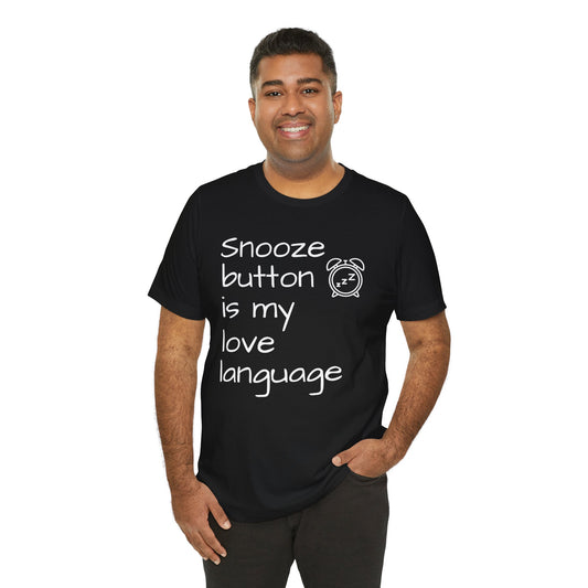 Man wearing a black t-shirt with text 'Snooze button is my love language' on a white background