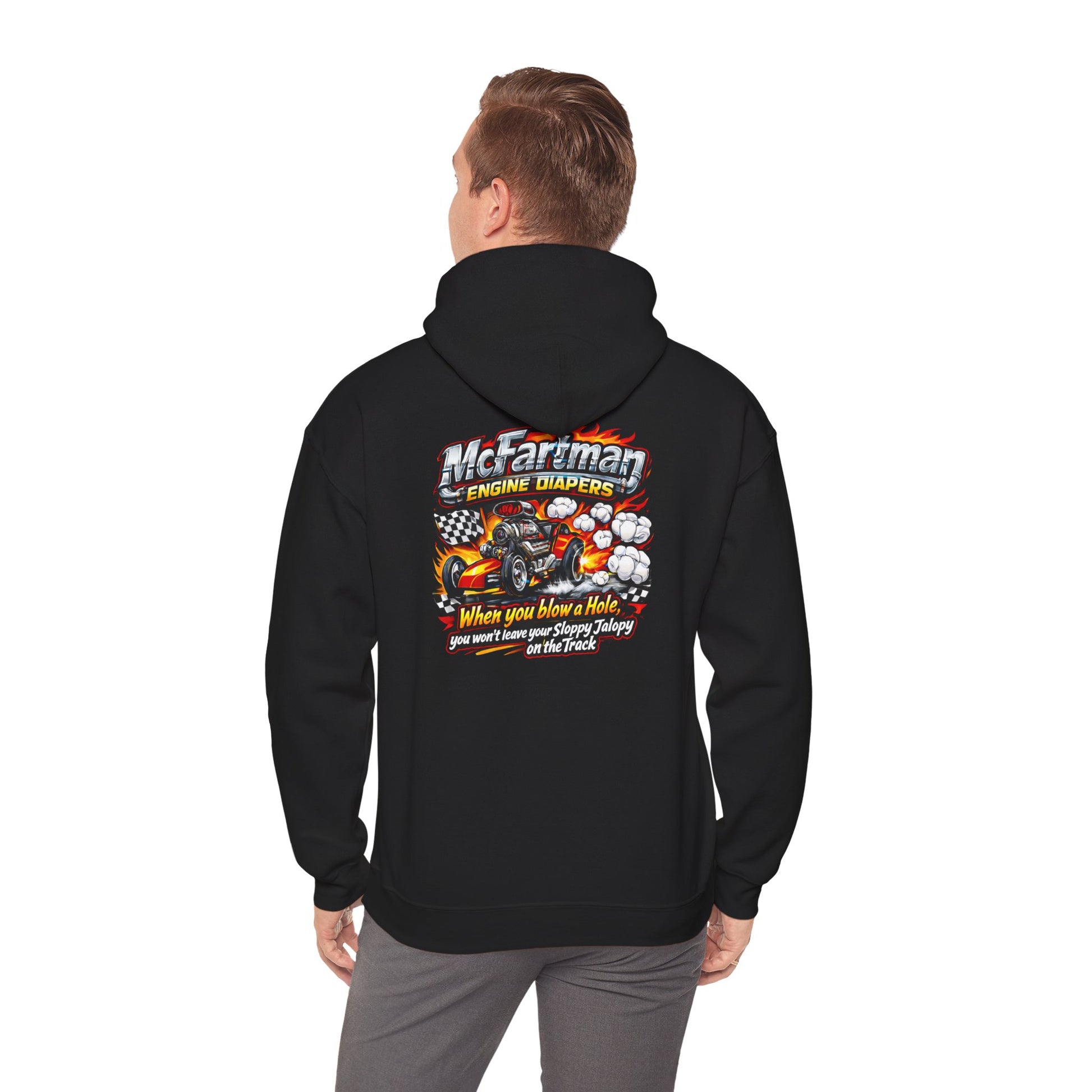 Black hoodie with a colorful graphic and  'McFartman Engine Diapers When You Blow a Hole You Won't Leave Your Sloppy Jalopy On The Track' text on the back, worn by a person.