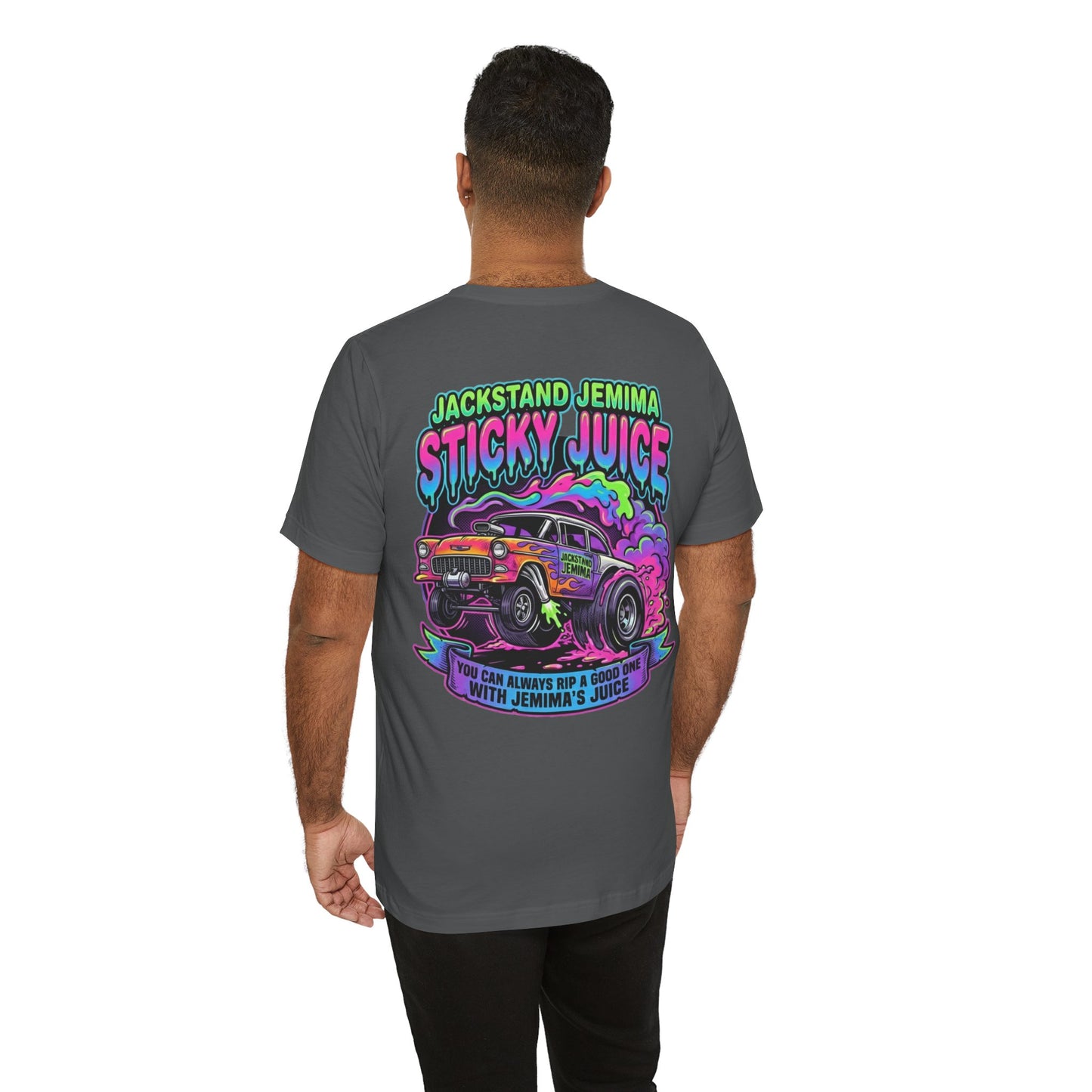 Person wearing a gray t-shirt with colorful graphic design on the back, featuring text 'Jackedstand Jemima Sticky Juice You Can Always Rip A Good One With Jemima's Juice' and a car illustration.