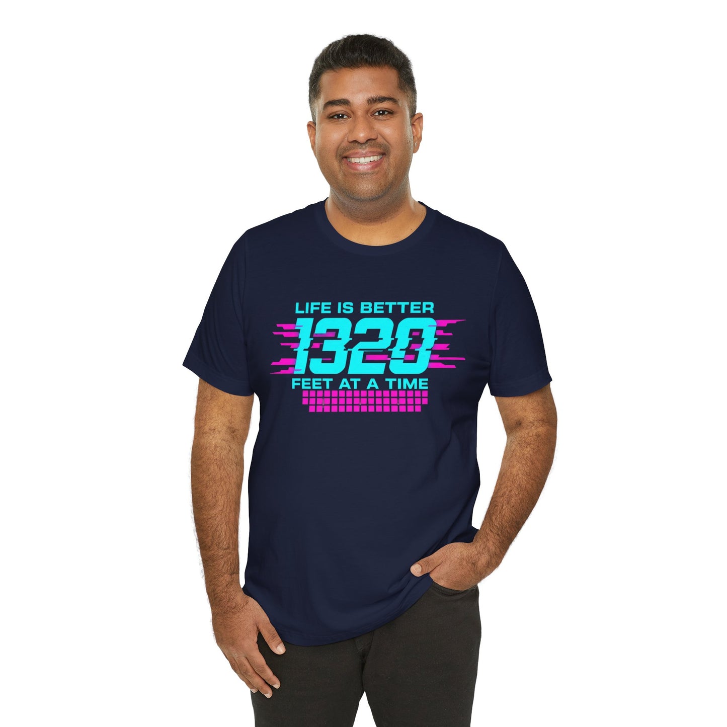 Man wearing a navy blue t-shirt with colorful text 'Life is better 1320 feet at a time' on a white background