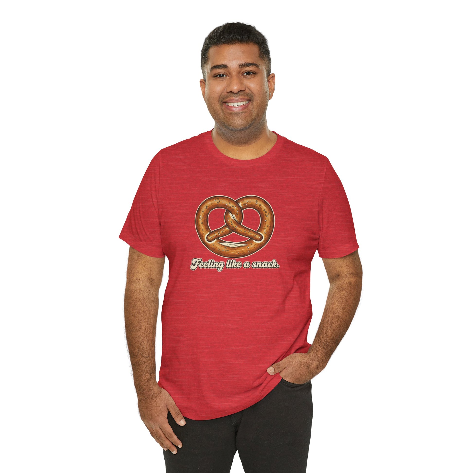 Man wearing a red t-shirt with a pretzel graphic and text 'Feeling like a snack' on a white background