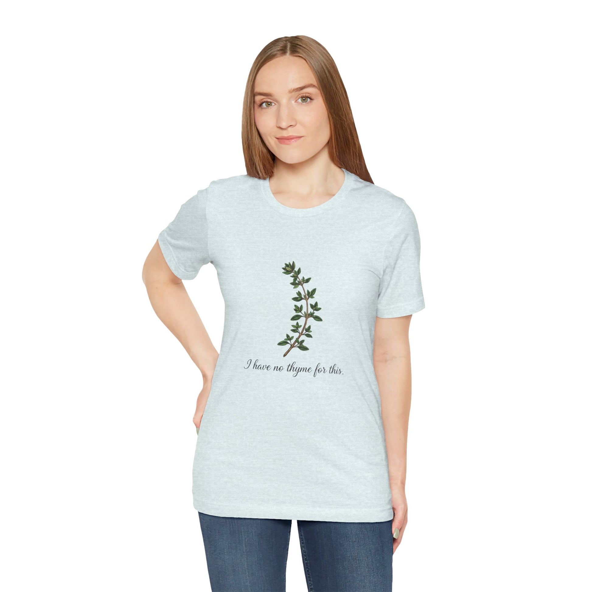 Woman wearing a light blue t-shirt with a plant design and text 'I have no thyme for this' on a white background