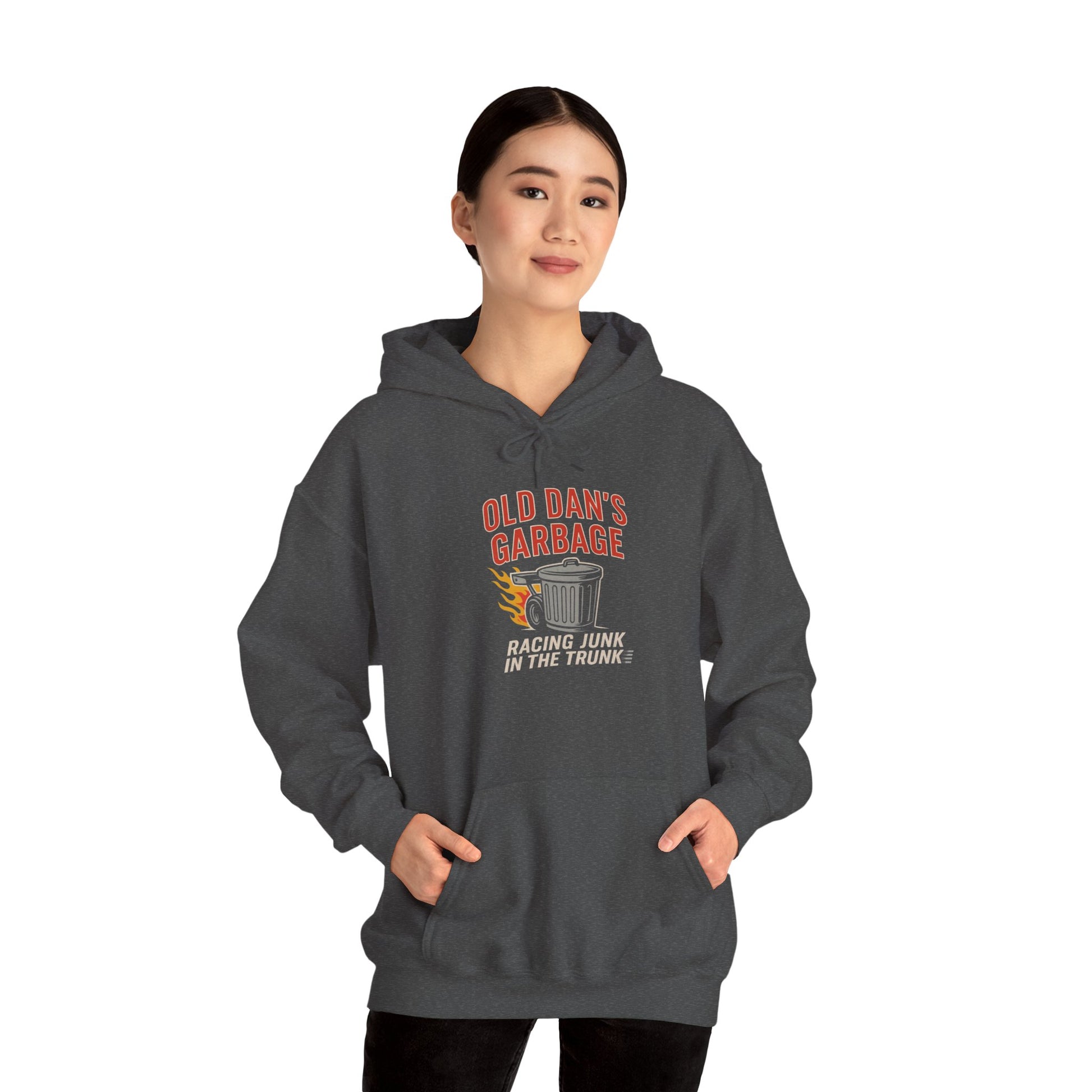 Person wearing a dark gray hoodie with 'Old Dan's Garage' graphic design on a white background