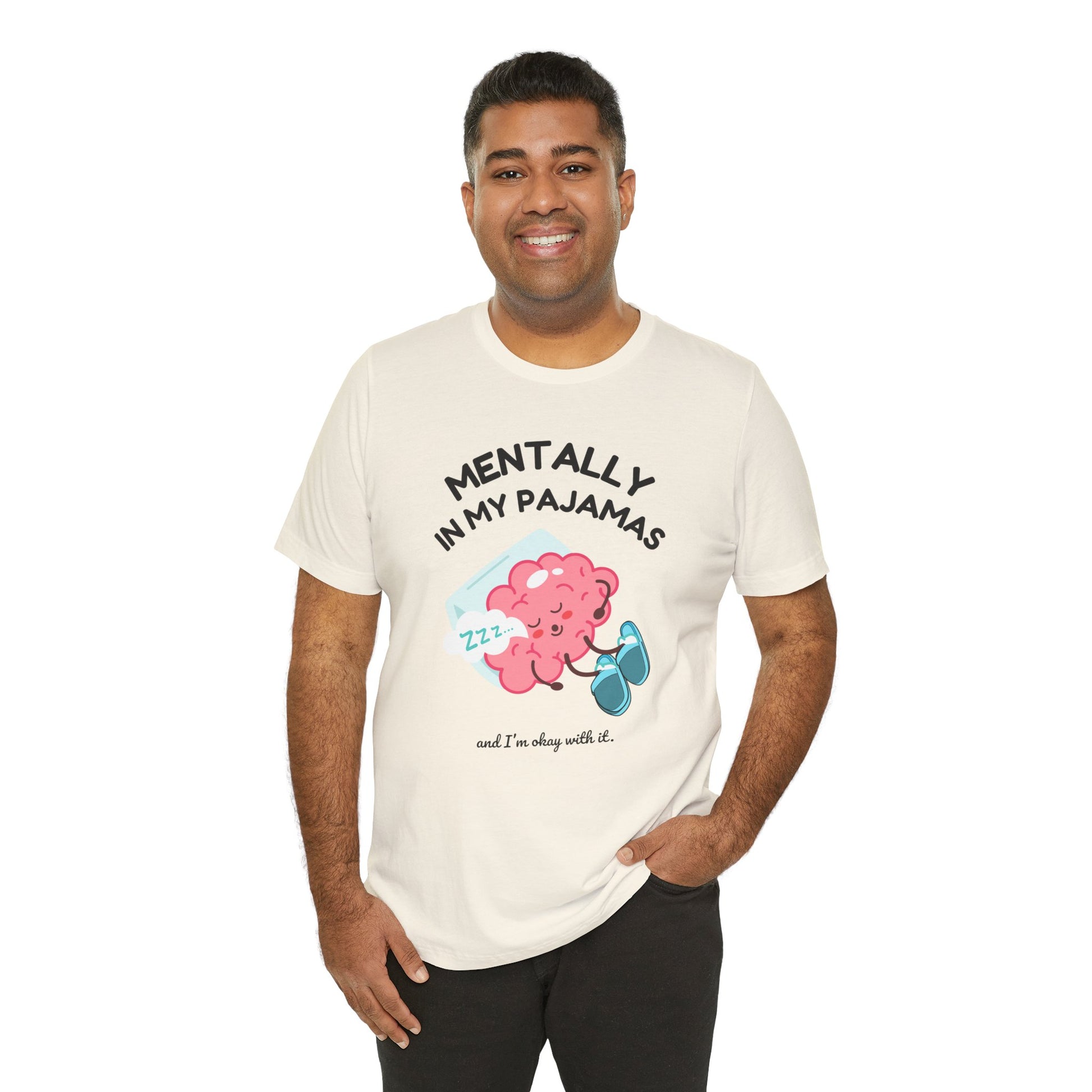 Man wearing a t-shirt with a cartoon character and text 'Mentally in my pajamas and I'm ok with it' on a white background