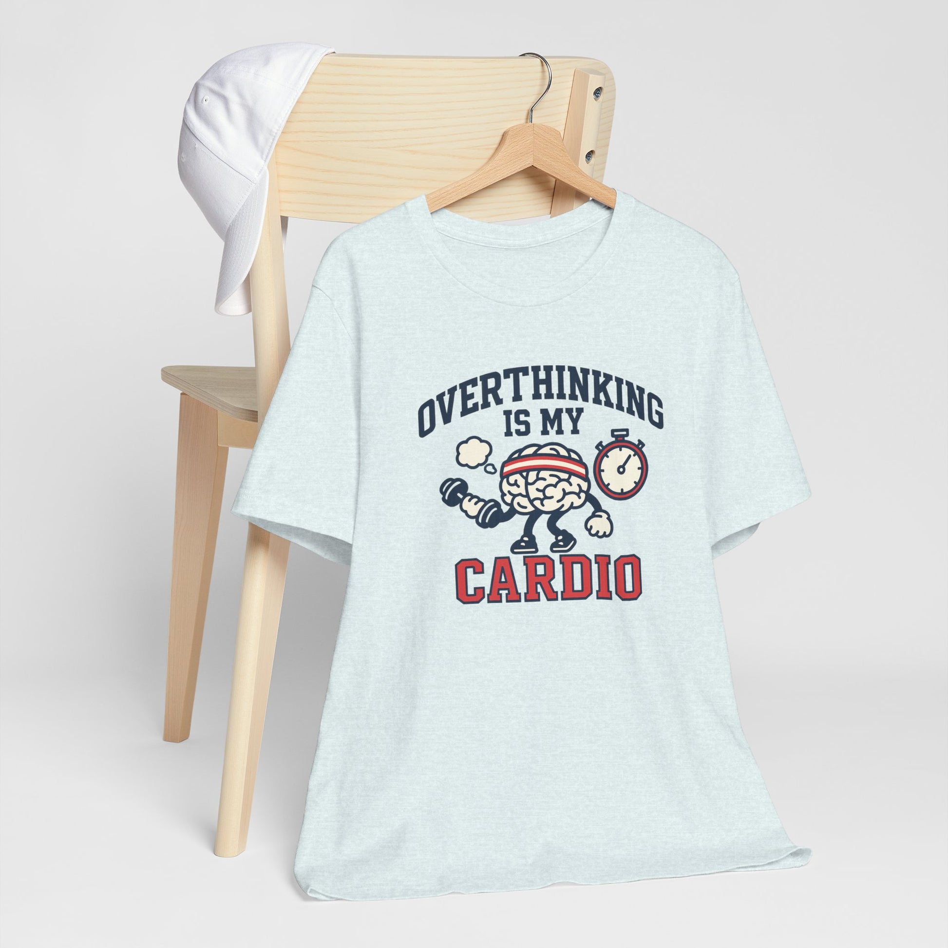 Light blue t-shirt with 'Overthinking is my Cardio' graphic on a chair against a white background