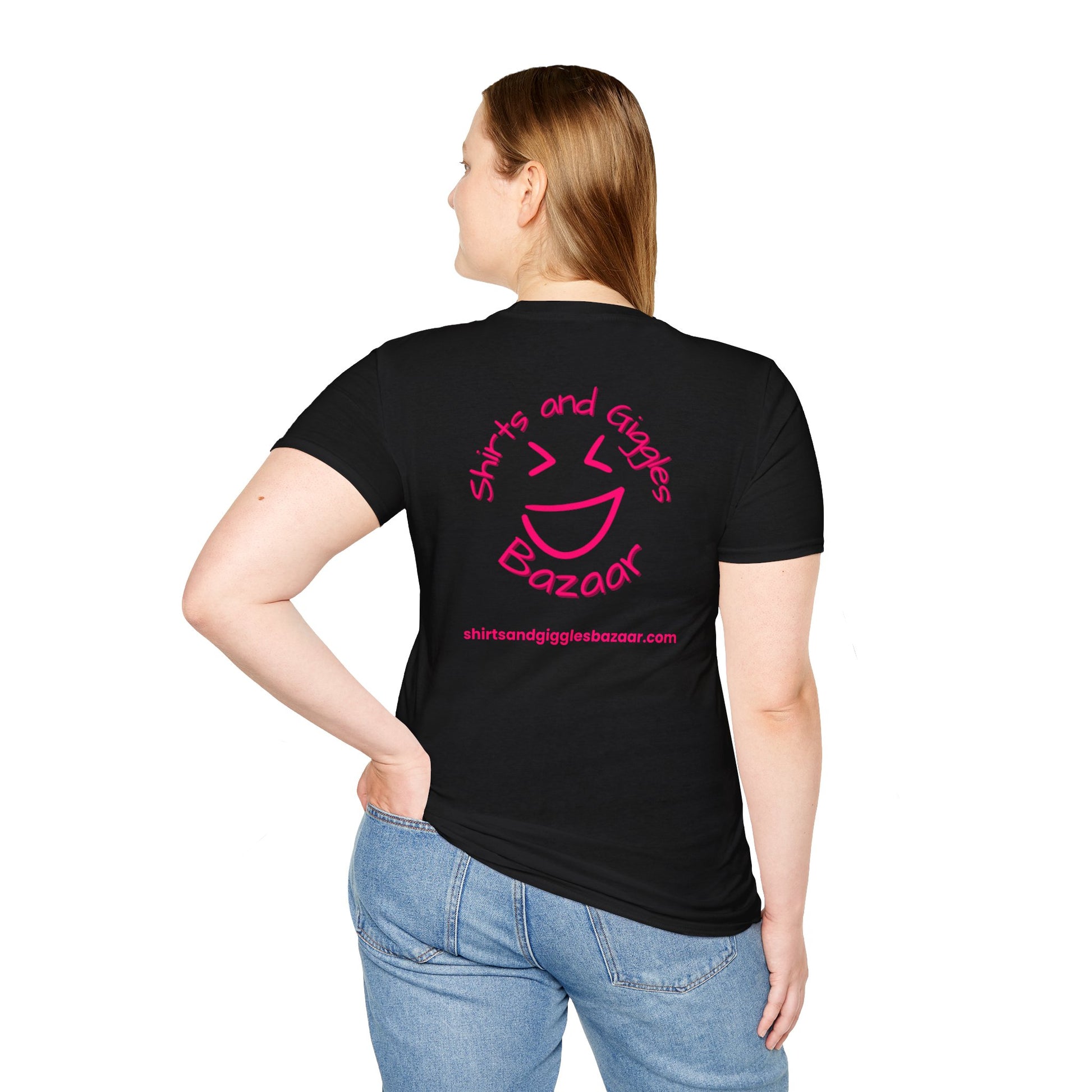 Person wearing a black t-shirt with a pink 'Shirts and Giggles Bazaar' logo on the back
