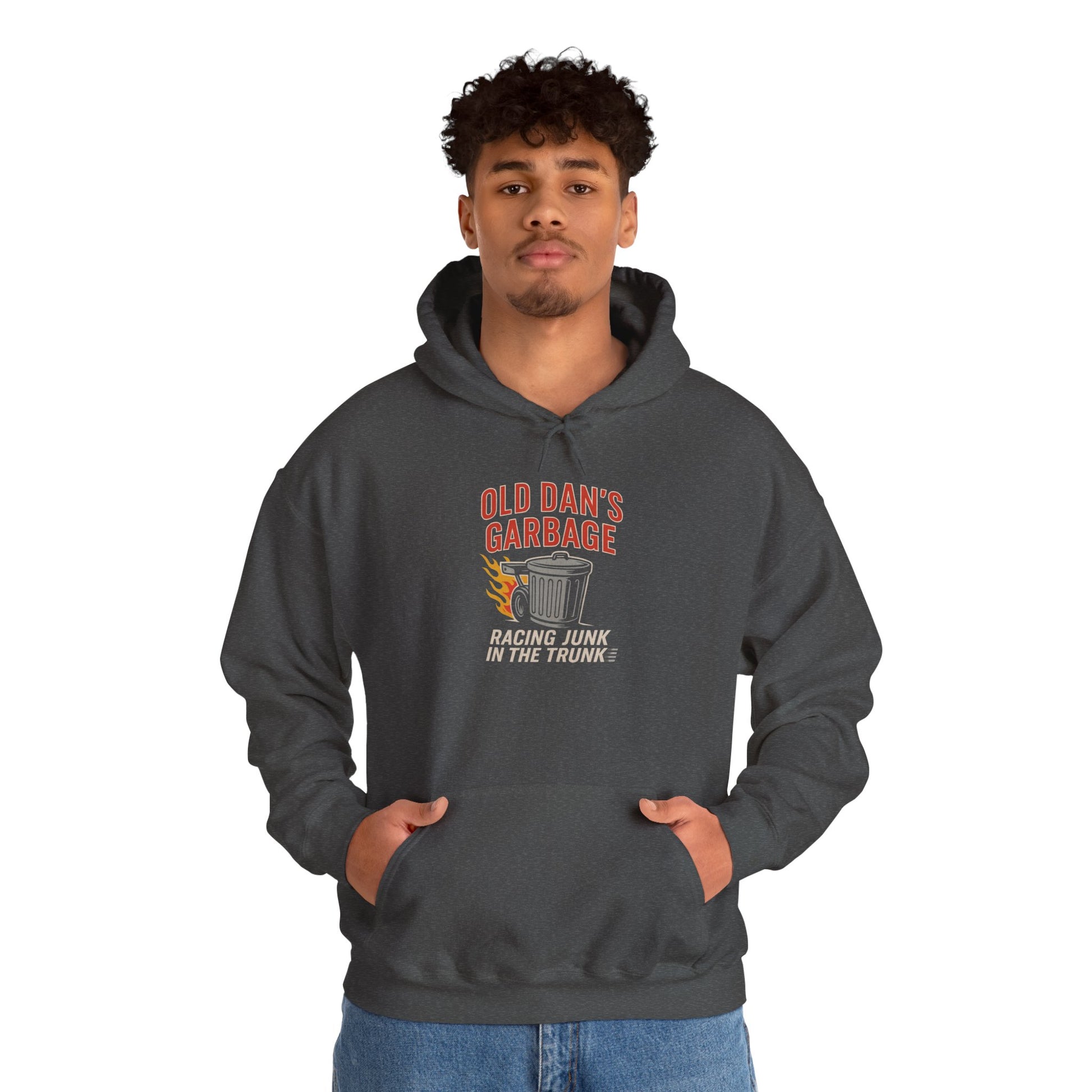 Person wearing a dark gray hoodie with Old Dan's Garbage Racing Junk In The Trunk graphic design on a white background