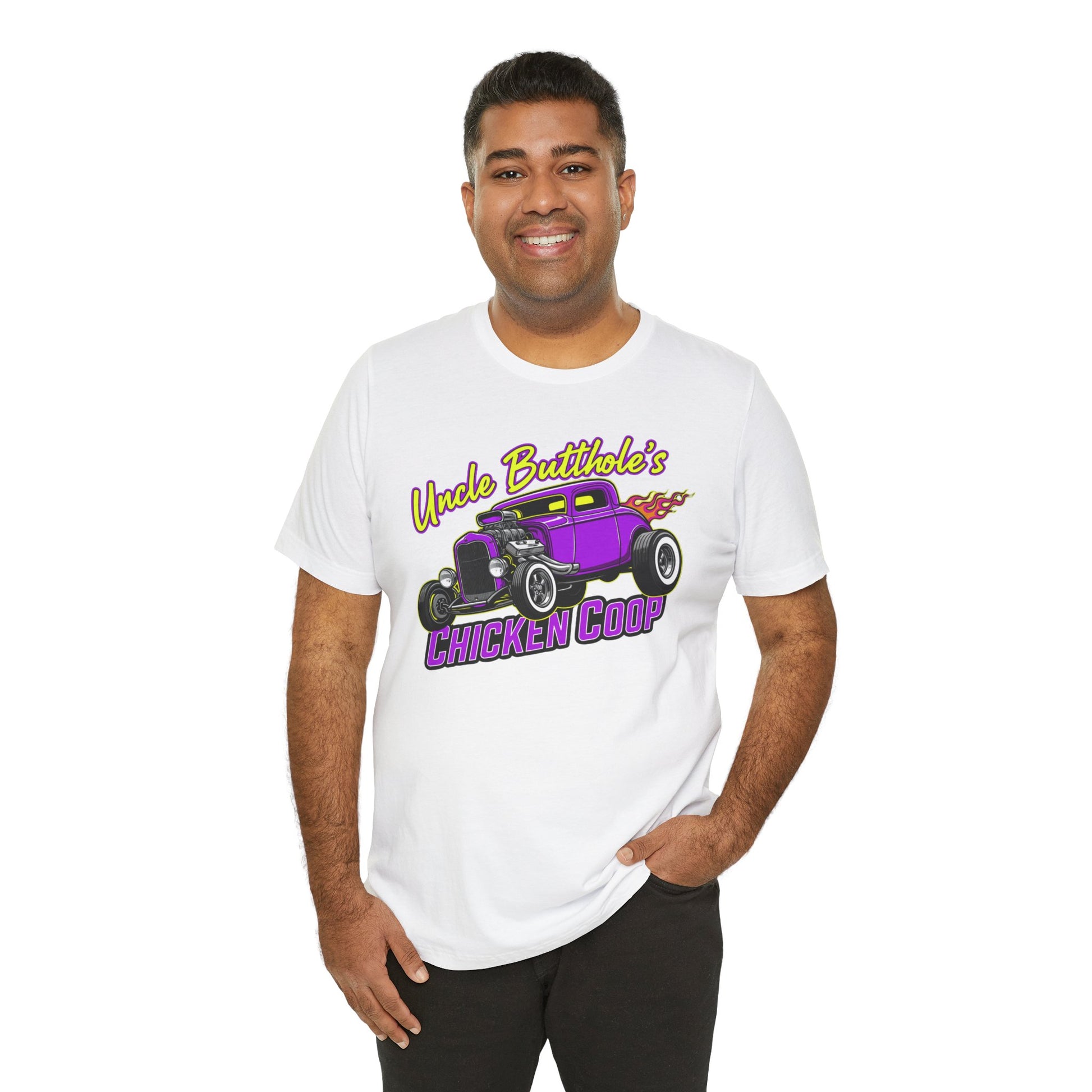 Man wearing a white t-shirt with a graphic design of a purple car and text 'Uncle Butthole's Chicken Coop' on a white background