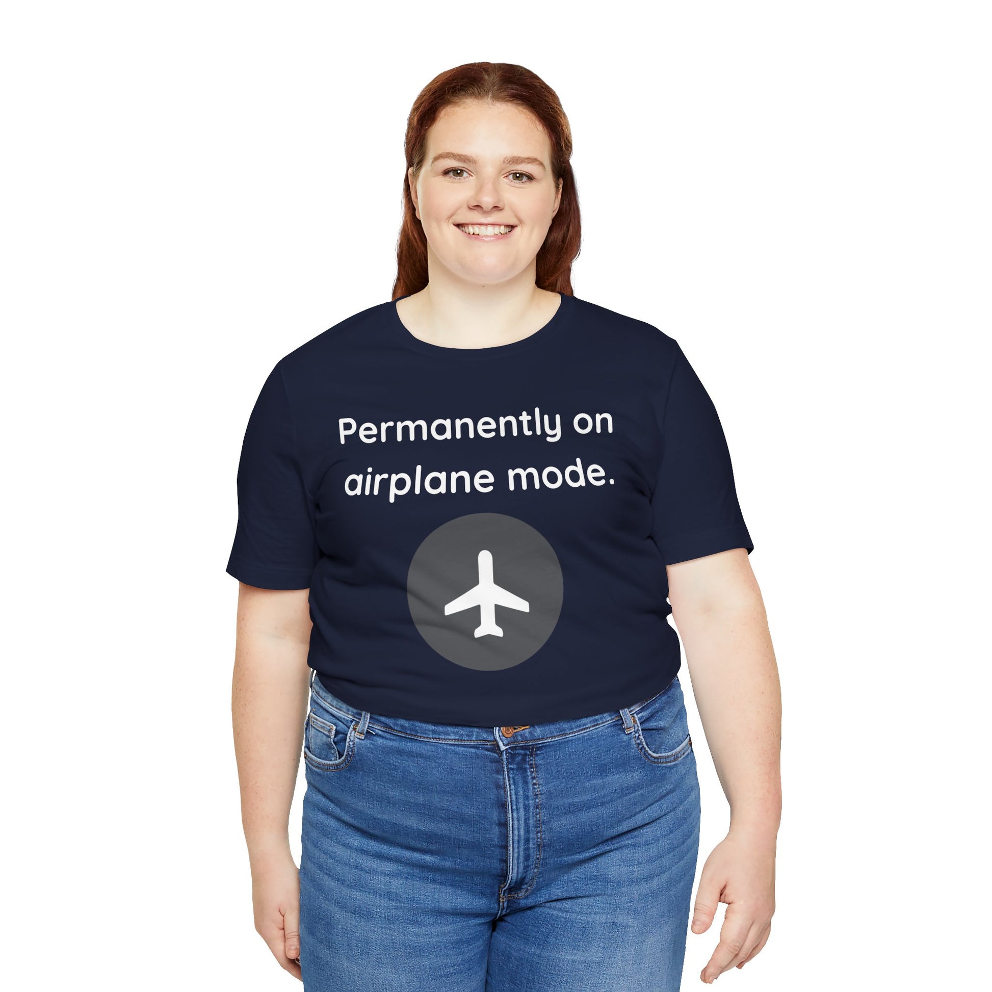 Person wearing a navy blue t-shirt with 'Permanently on airplane mode' text and airplane icon.