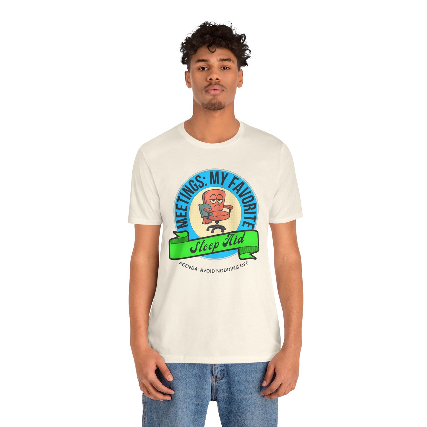 Person wearing a white t-shirt with a graphic design and text 'Meetings: My favorite sleep aid. Agenda: Avoid nodding off' on a white background