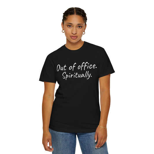 Person wearing a black t-shirt with 'Out of office. Spiritually.' text on a white background