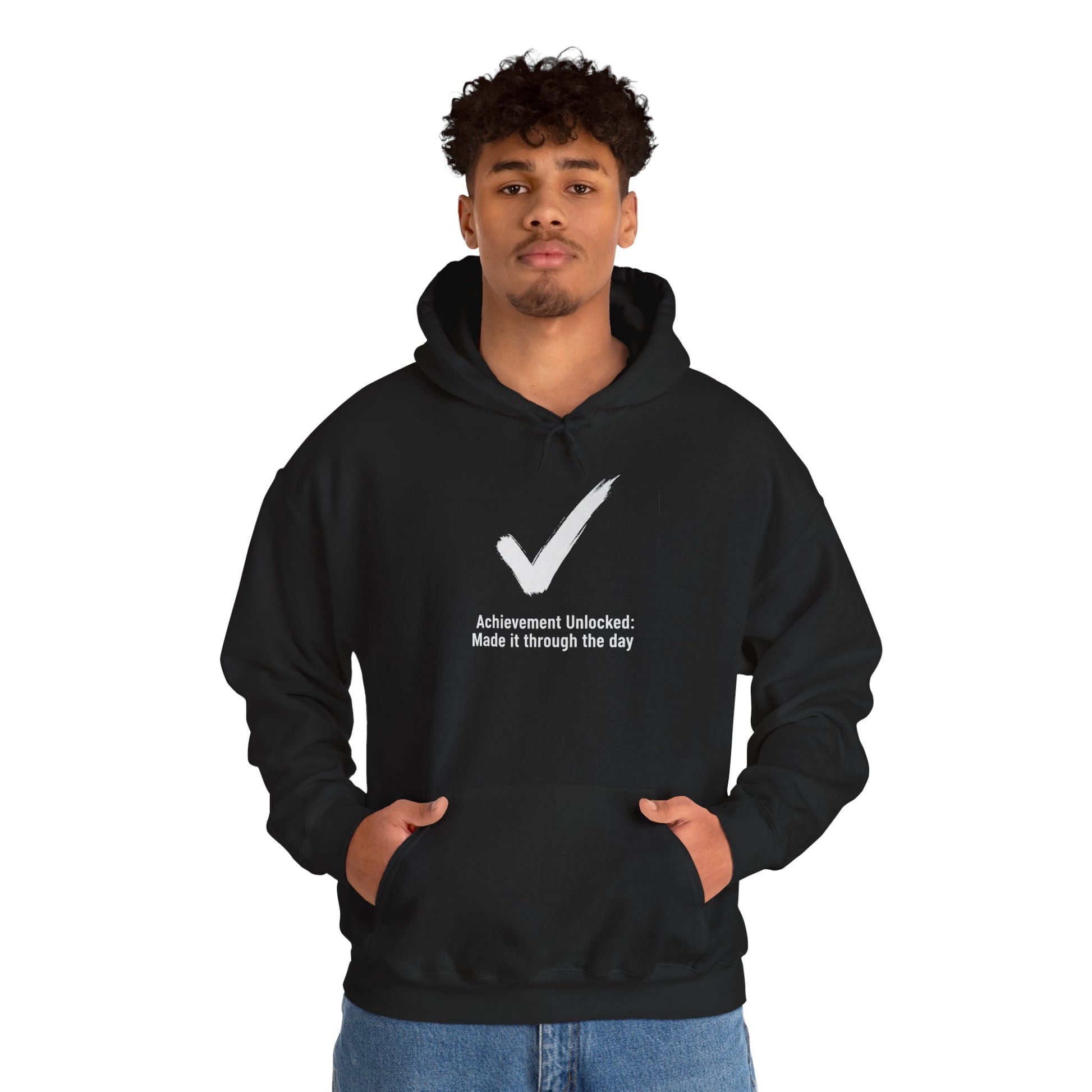Person wearing a black hoodie with a white checkmark and text 'Achievement Unlocked: Made it through the day' on a white background