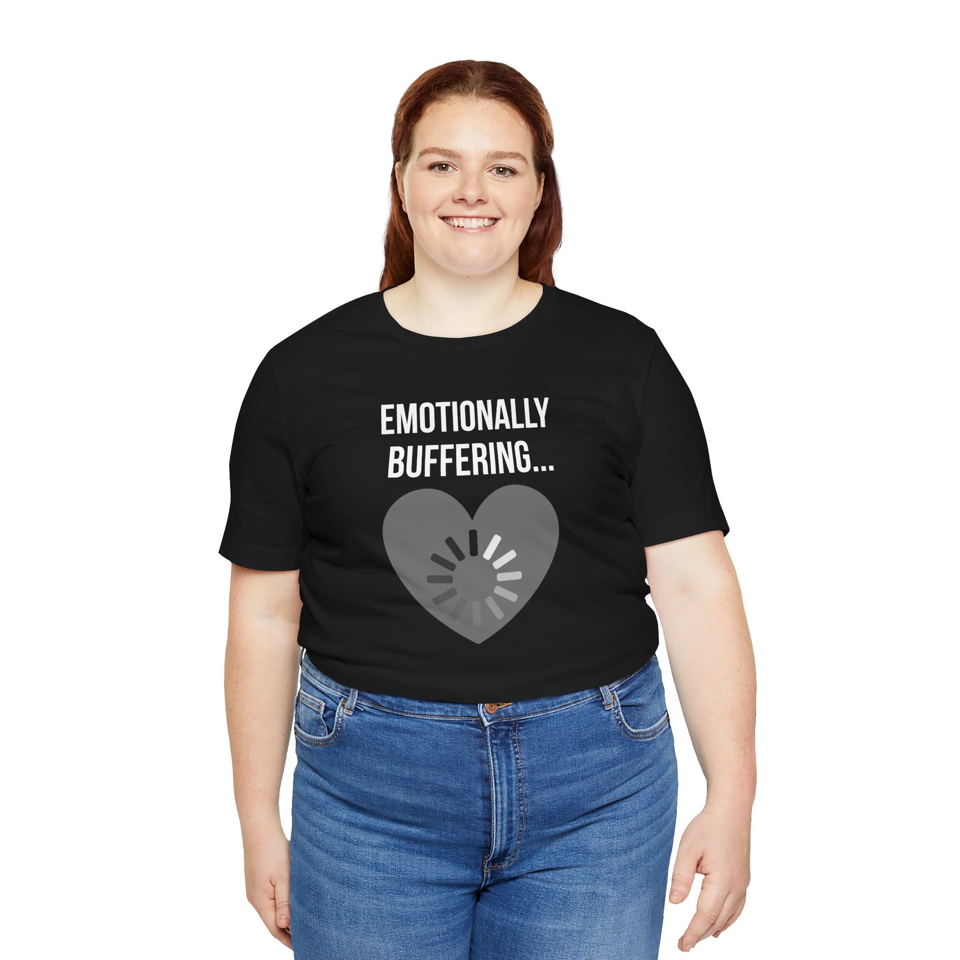 Person wearing a black t-shirt with 'Emotionally Buffering' text and heart design on a white background