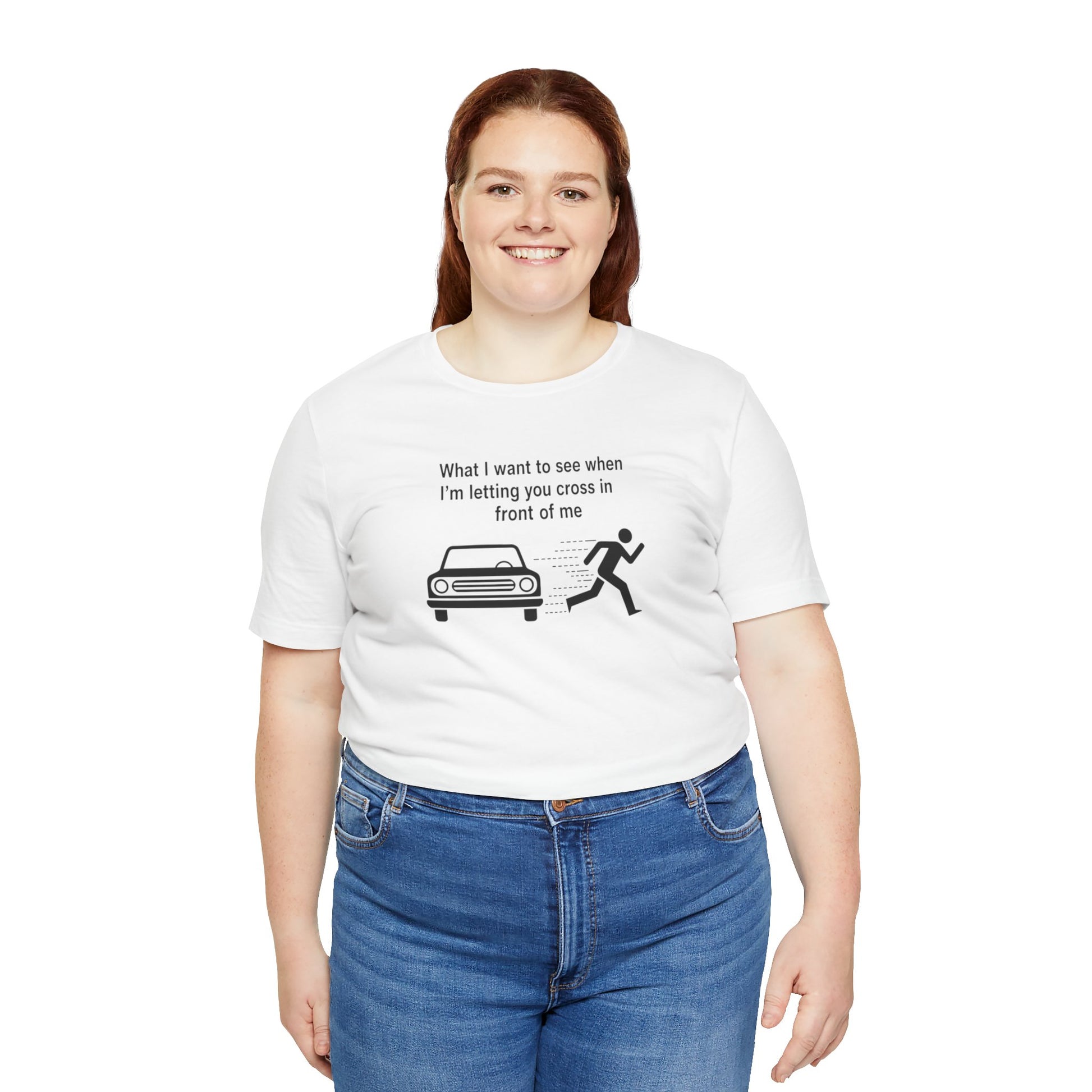 Person wearing a white t-shirt with a graphic and text 'What I want to see when I'm letting you cross in front of me' on a white background