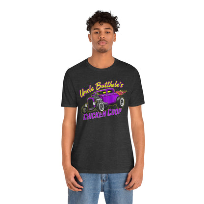 Person wearing a black t-shirt with a graphic design 'Uncle Butthole's Chicken Coop' on a white background