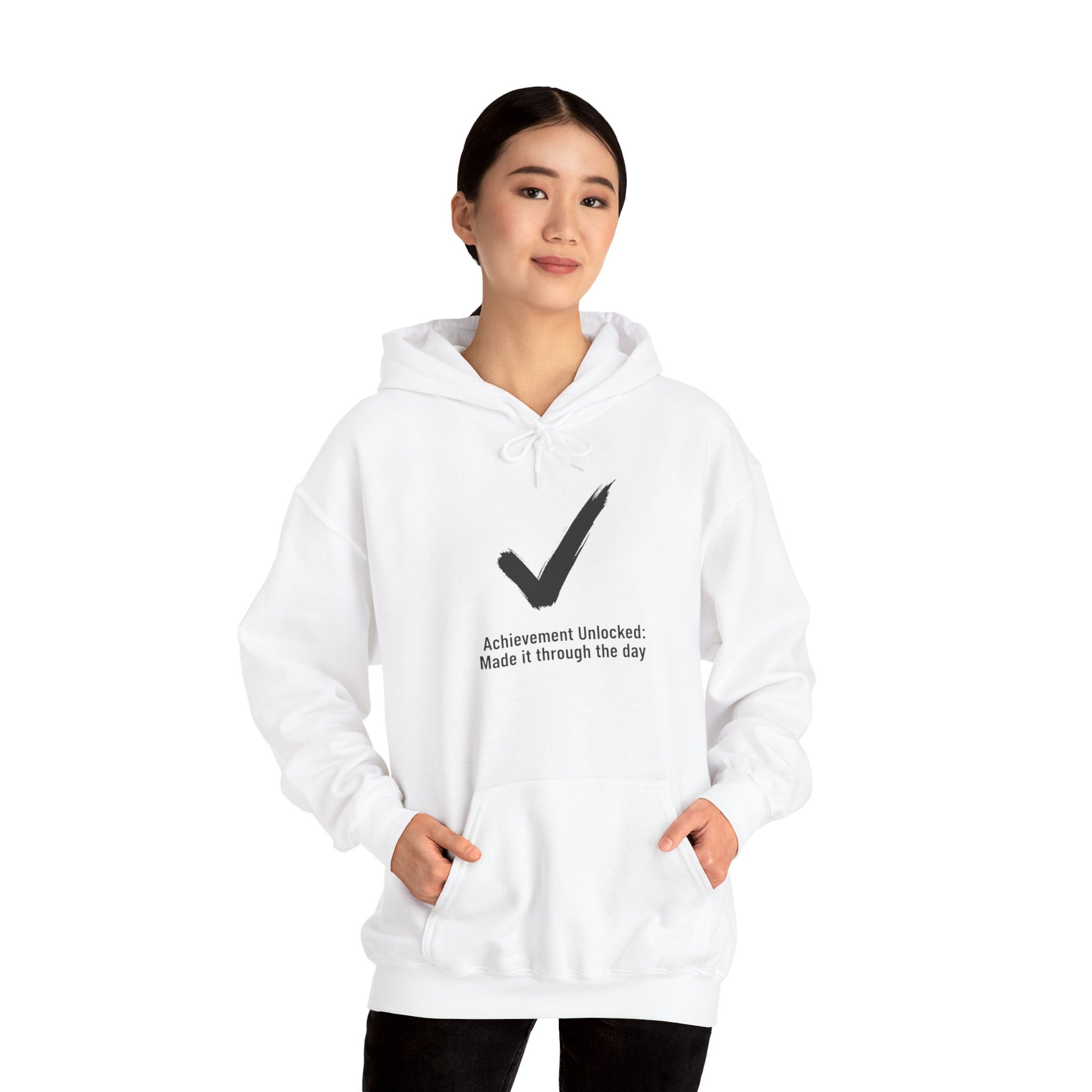 Person wearing a white hoodie with a black checkmark and text 'Achievement Unlocked: Made it through the day' on a white background