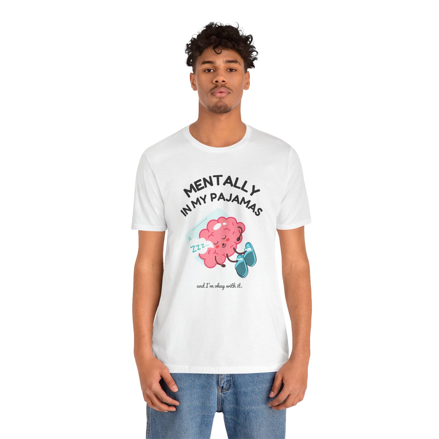 Person wearing a white t-shirt with a graphic design and text 'Mentally in my pajamas and I'm ok with it' on a white background