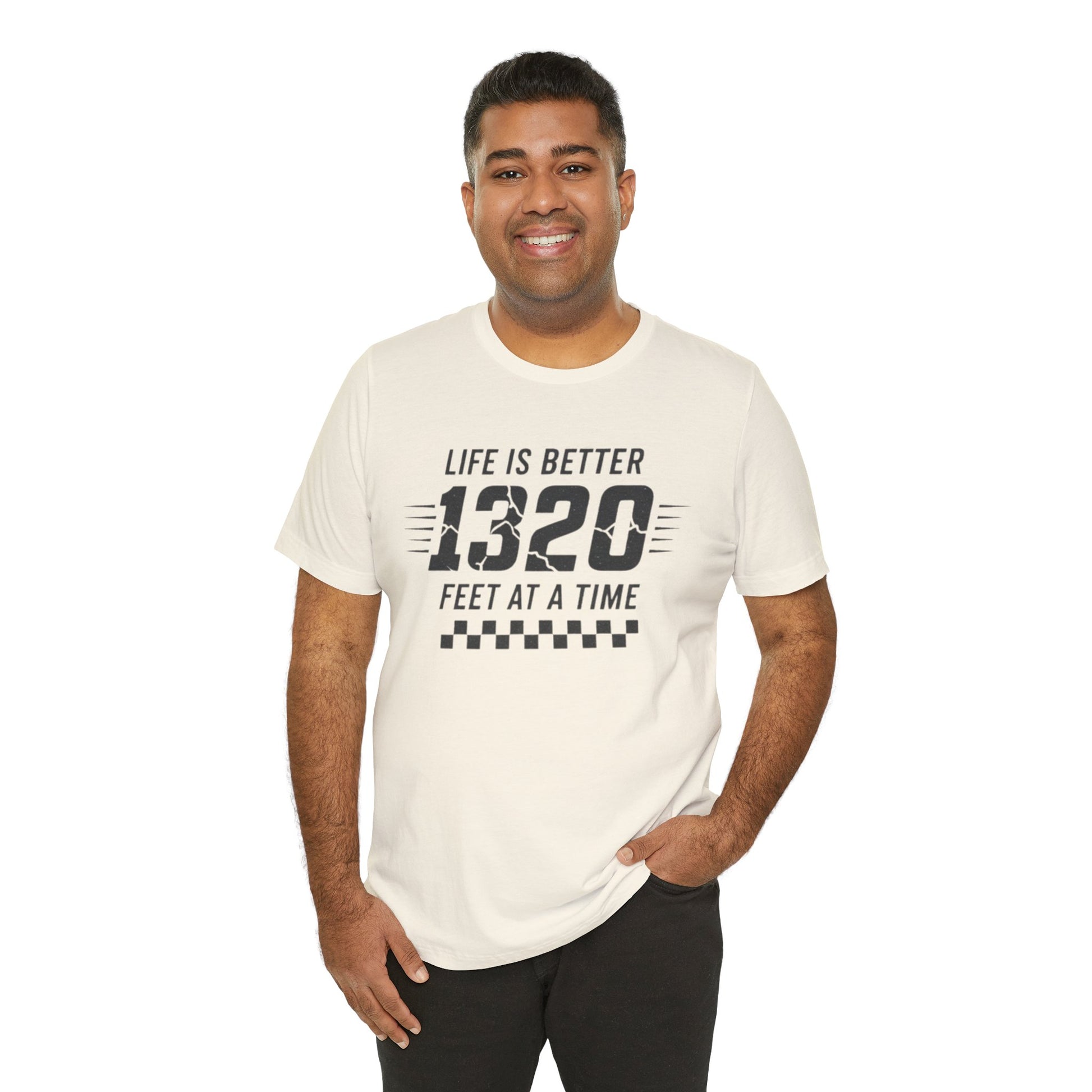 Man wearing a white t-shirt with text 'Life is better 1320 feet at a time' on a white background