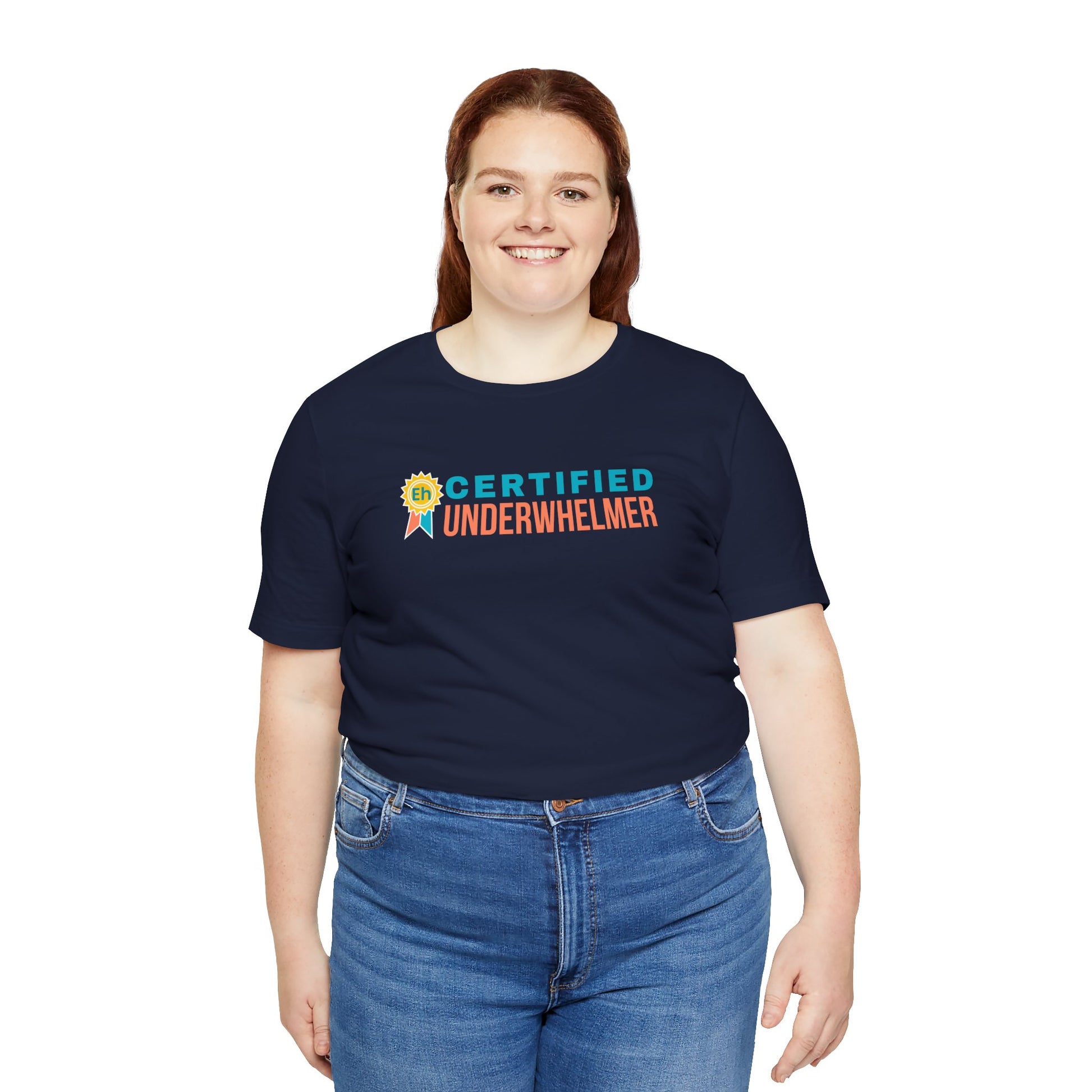 Person wearing a navy blue t-shirt with 'Certified Underwhelmer' text on a white background